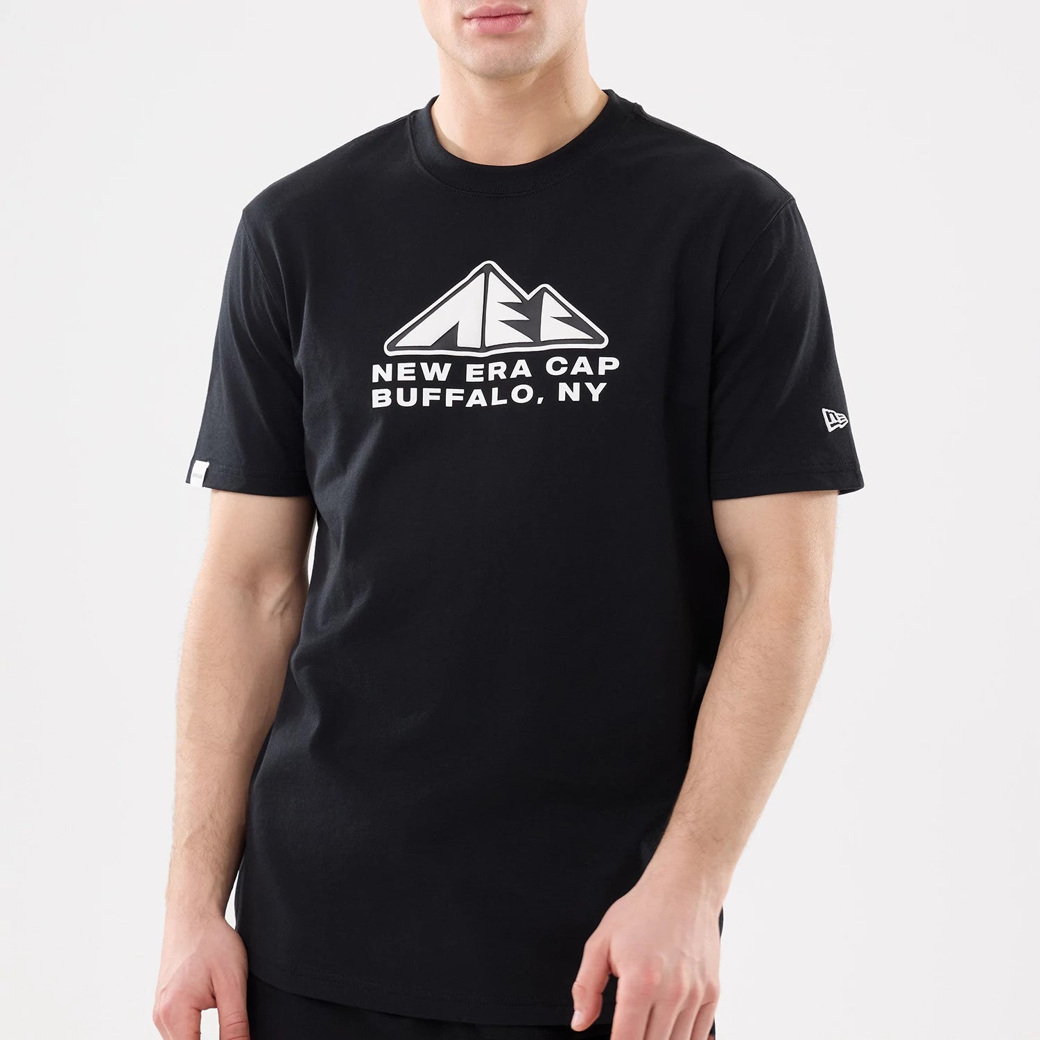 The model is wearing this New Era Outdoor Mountain T-Shirt in black. 3