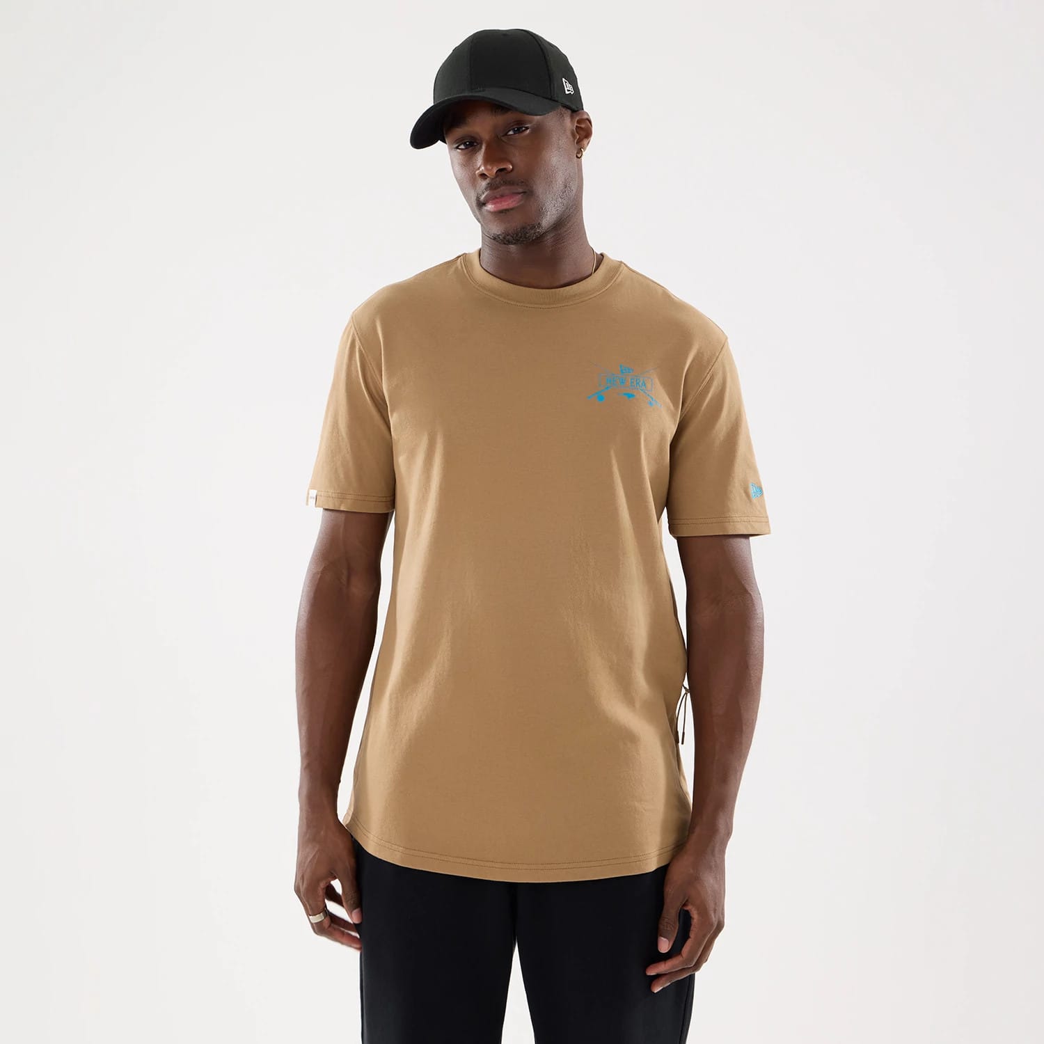 The model is wearing this New Era Outdoor Fishing T-Shirt in Beige. 1