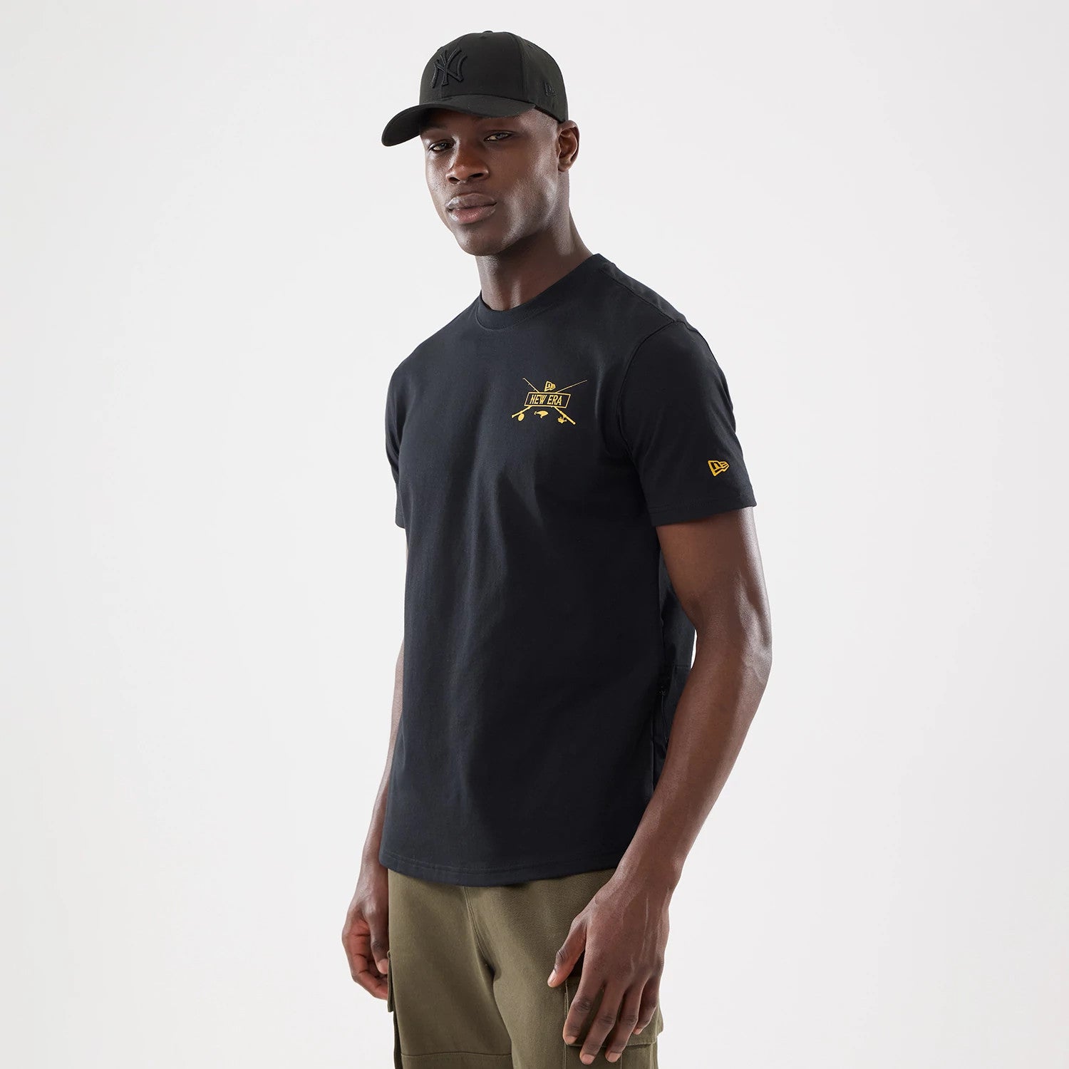 The model is wearing this New Era Outdoor Fishing T-Shirt in black. 1