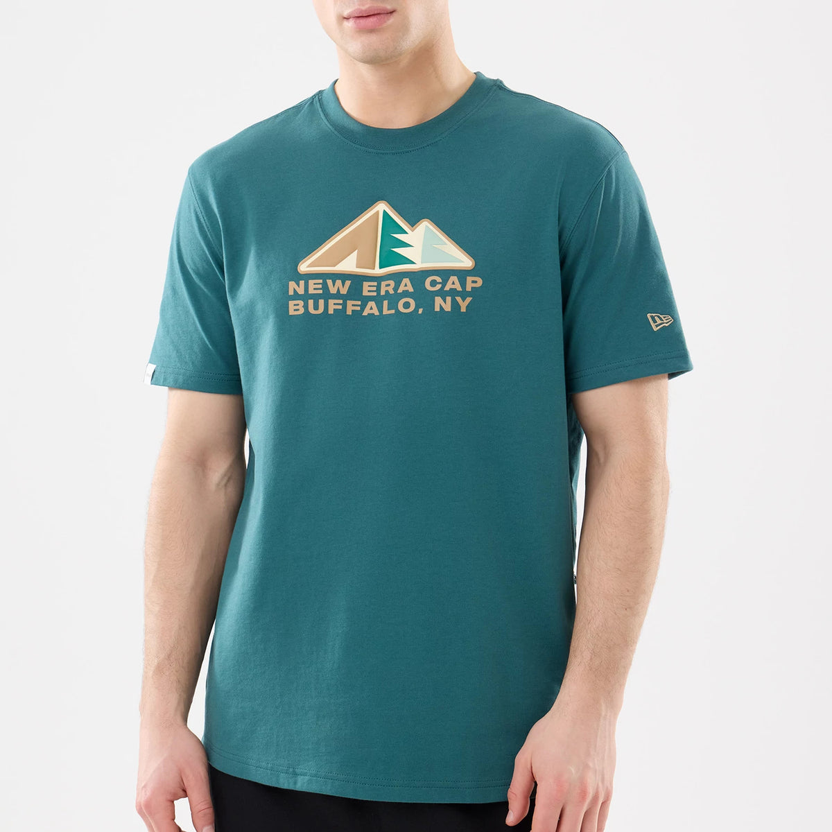 New Era Outdoor Mountain Dark Green T-Shirt, front view showing a large printed design of stylised mountains above text reading 'New Era Cap Buffalo, NY' on the chest and a small raised New Era logo on the left sleeve.