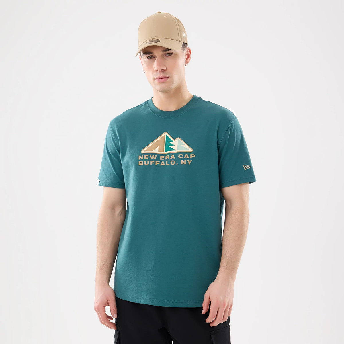 The model is wearing this New Era Outdoor Mountain T-Shirt in dark green. 1