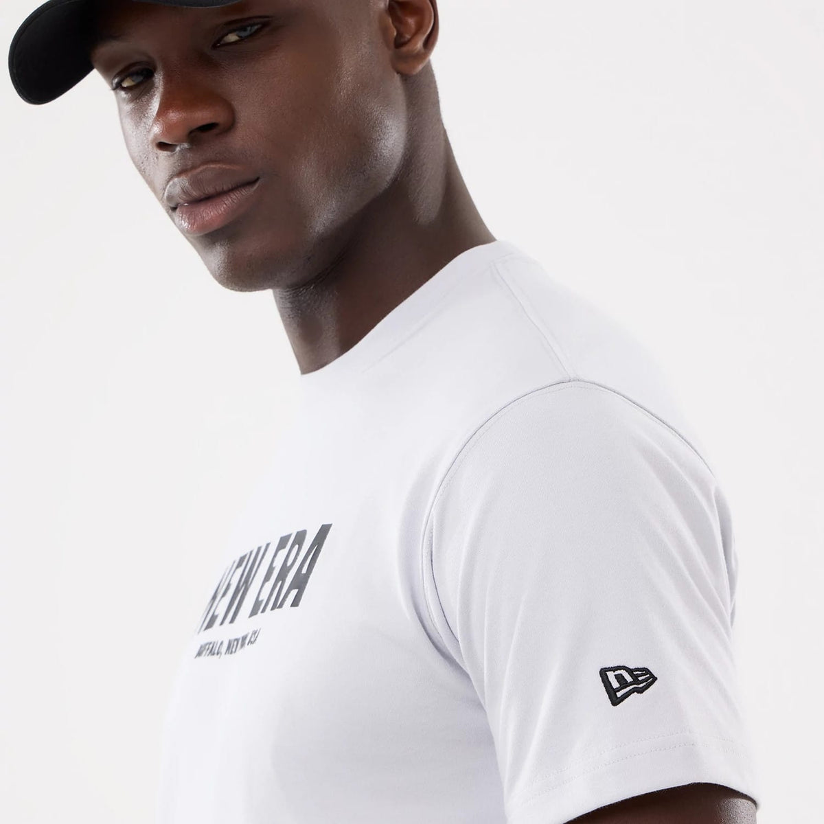 The model is wearing this New Era Basic T-Shirt in white. 4