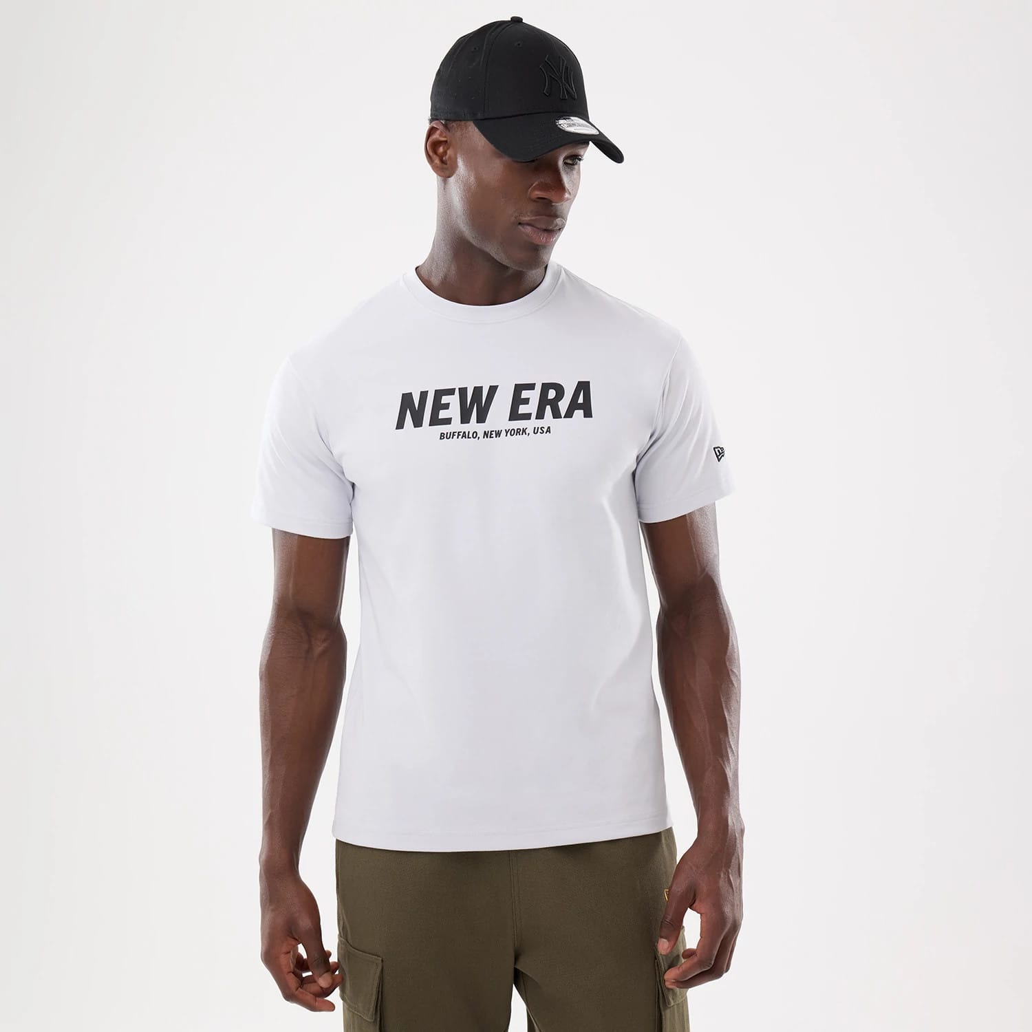 The model is wearing this New Era Basic T-Shirt in white. 1