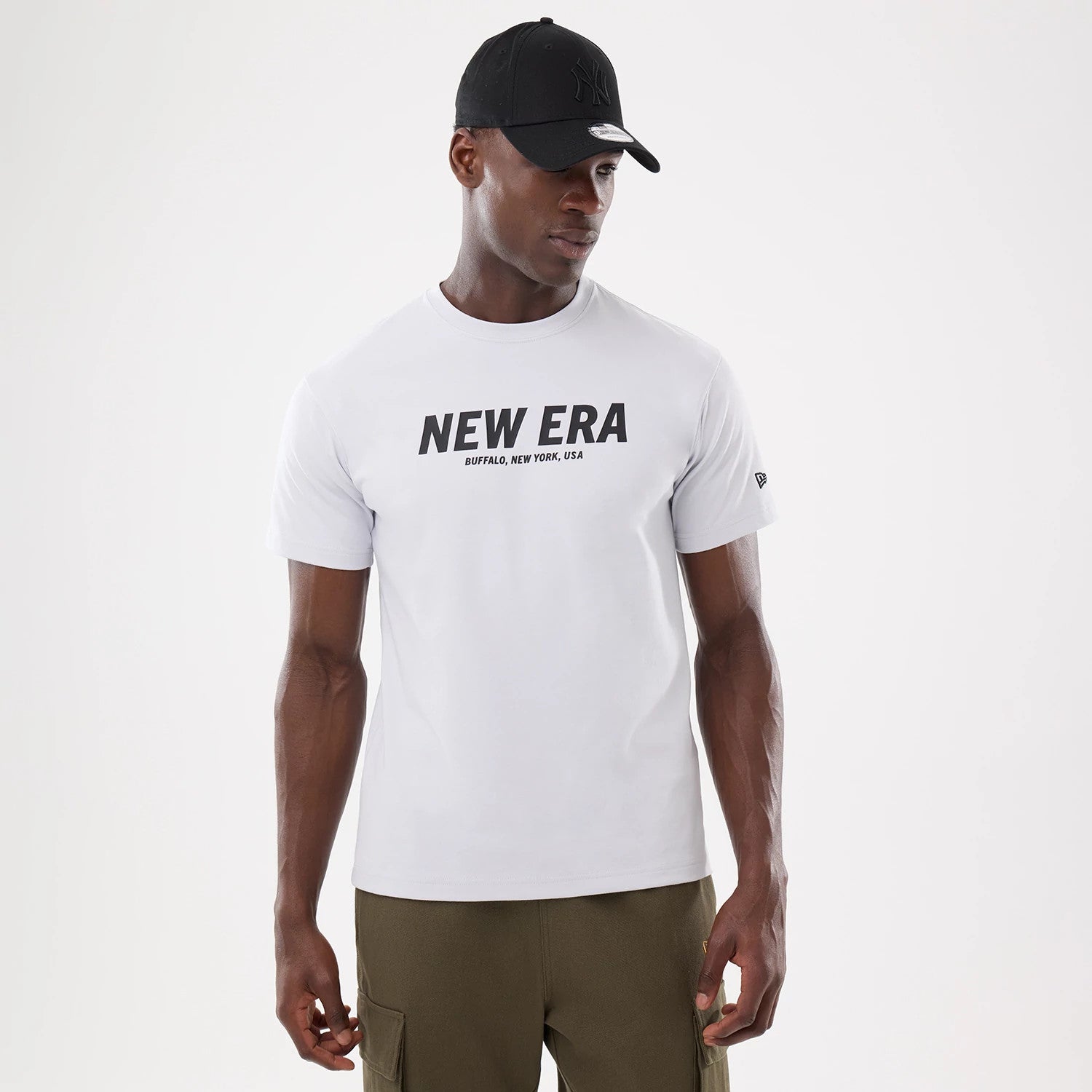 The model is wearing this New Era Basic T-Shirt in white. 1