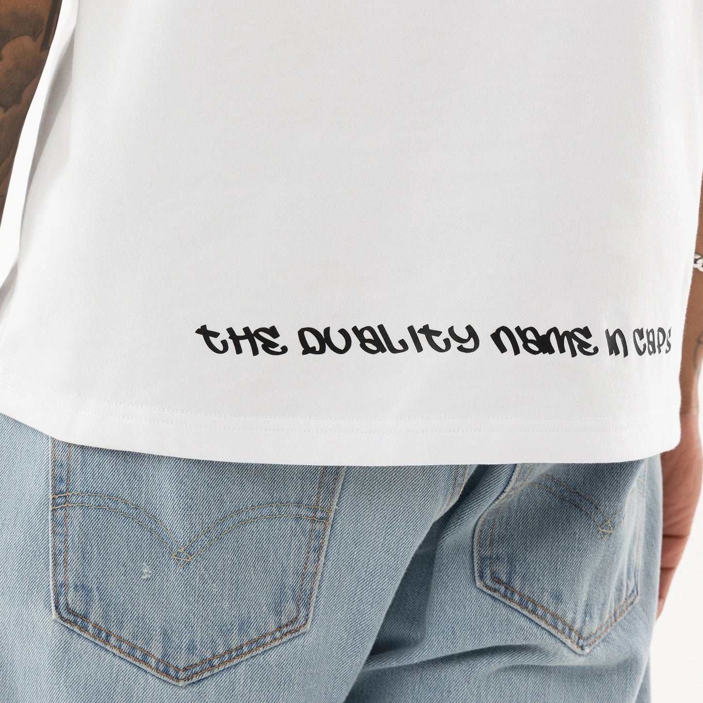 The model is wearing this New Era I Am Original T-Shirt in white. 7