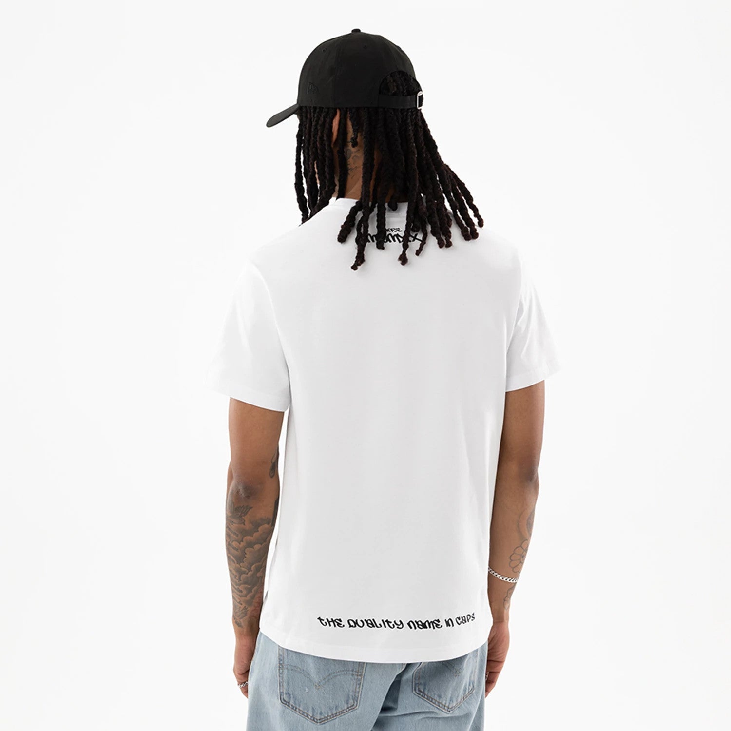 The model is wearing this New Era I Am Original T-Shirt in white. 2