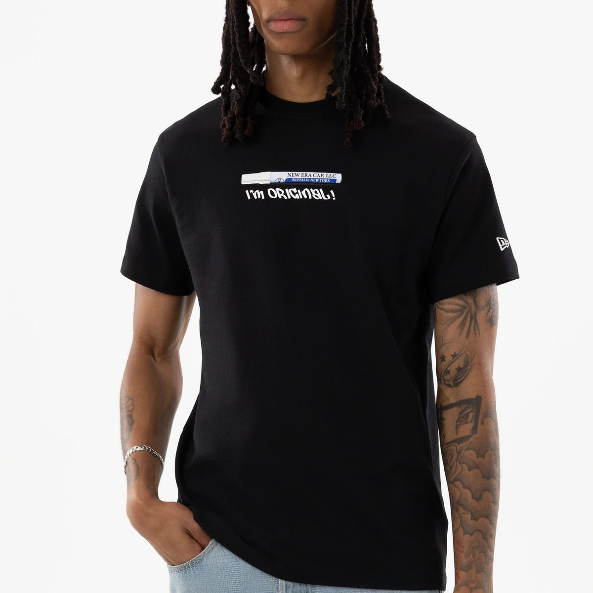 New Era I Am Original Black T-Shirt, front view featuring a black t-shirt with the slogan "I'm Original!" printed in white across the chest, complemented by a small debossed New Era logo on the left sleeve.