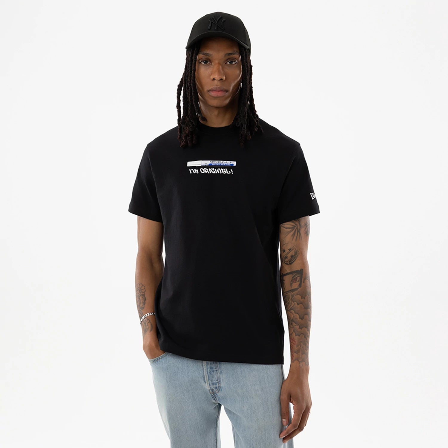 The model is wearing this New Era I Am Original T-Shirt in black. 1