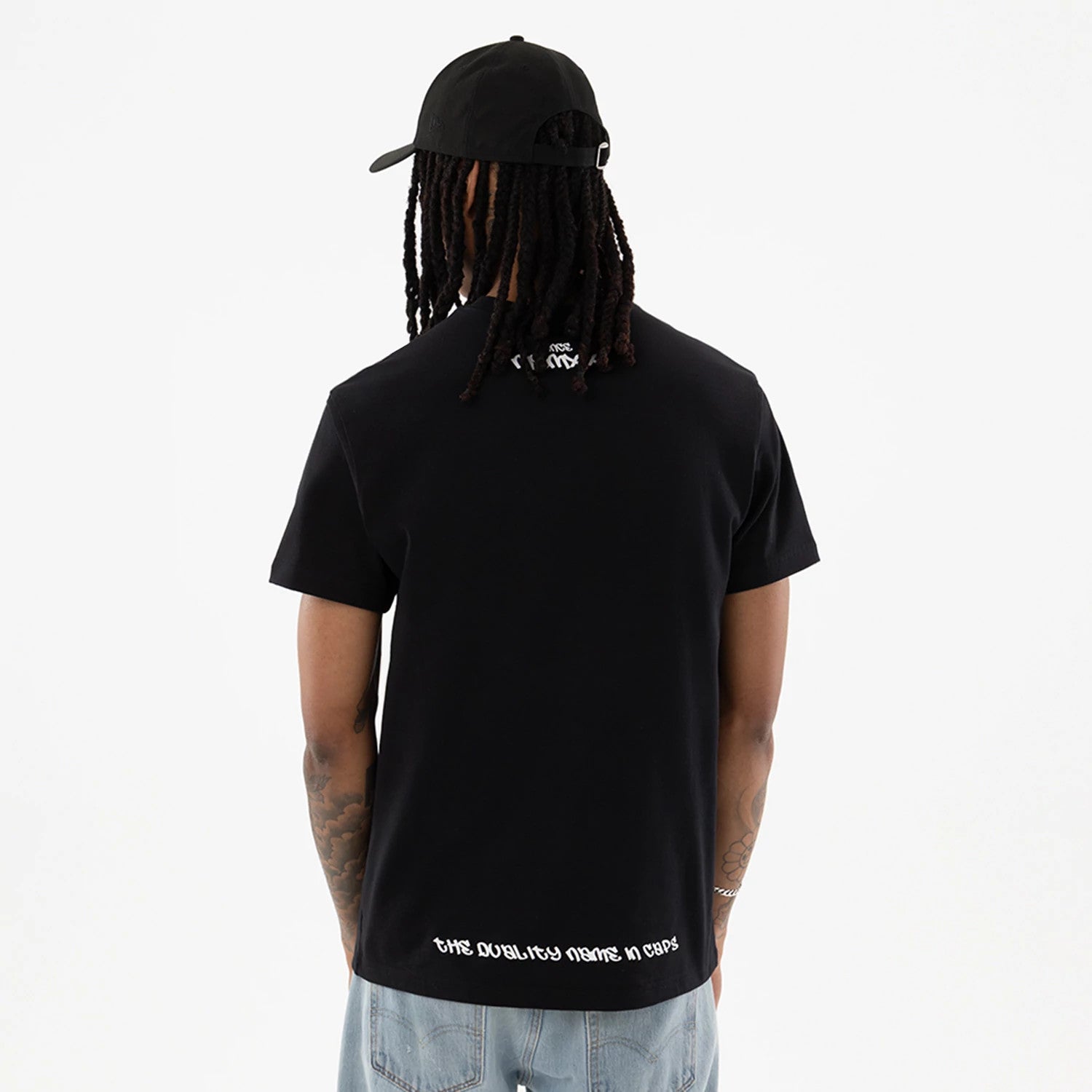 The model is wearing this New Era I Am Original T-Shirt in black. 2