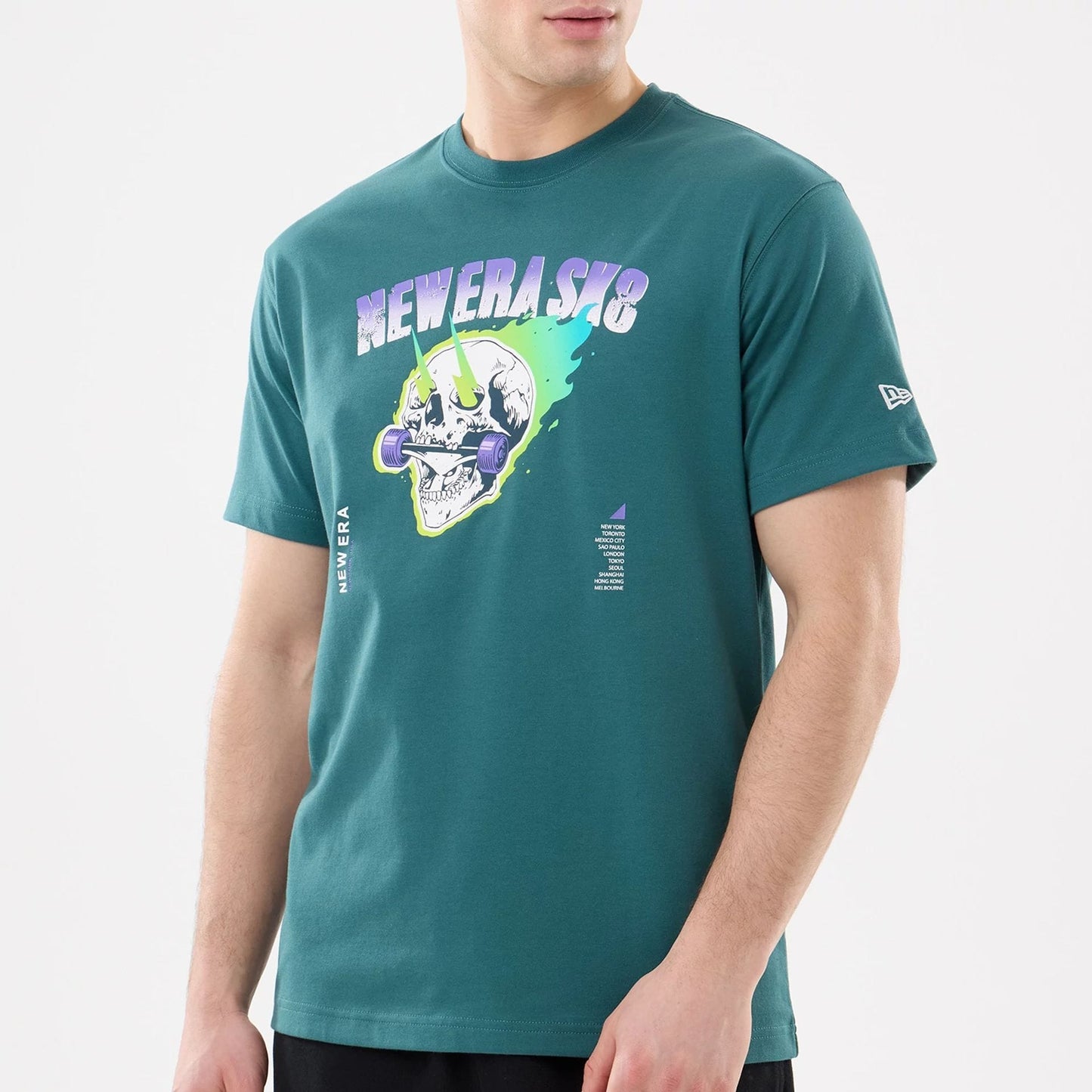 New Era SK8 Graphic Dark Green T-Shirt, three-quarter view showing a bold graphic of a skull with a barbell on the chest, NEWERASK8 text in purple above, and a small raised logo on the left sleeve.