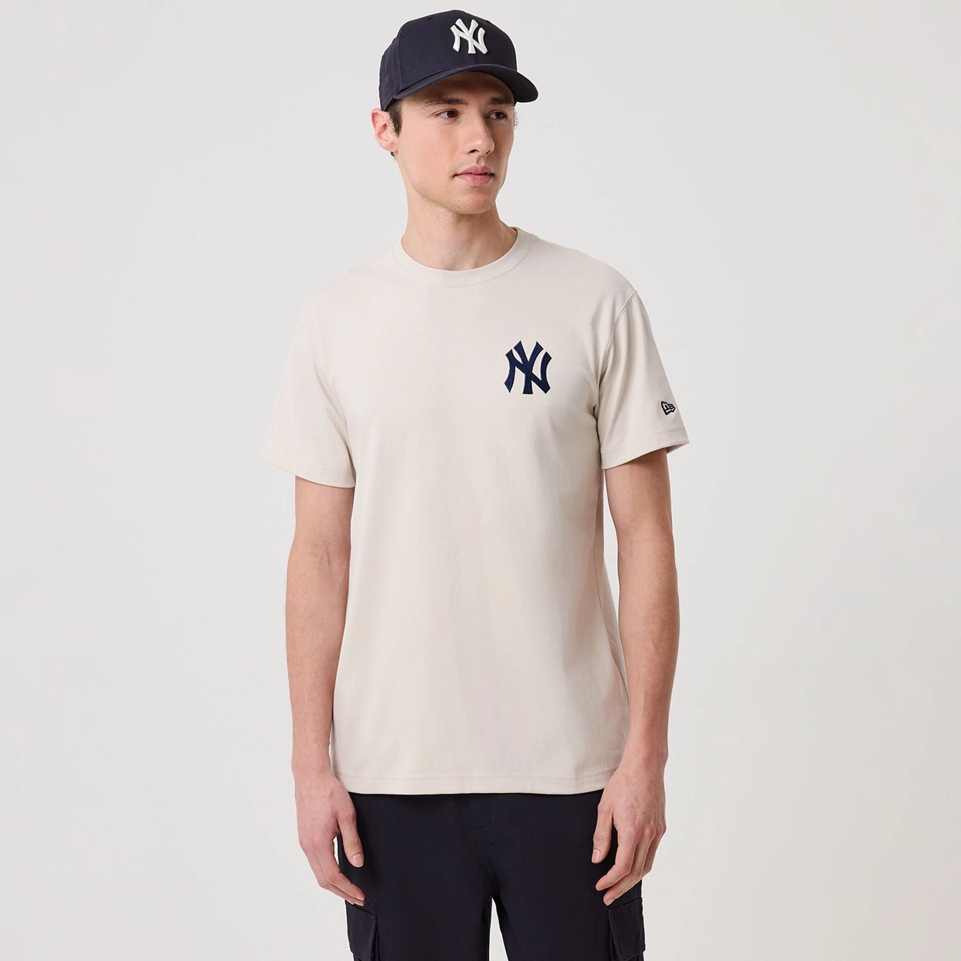 The model is wearing this MLB Banana Graphic New York Yankees T-Shirt in natural. 1