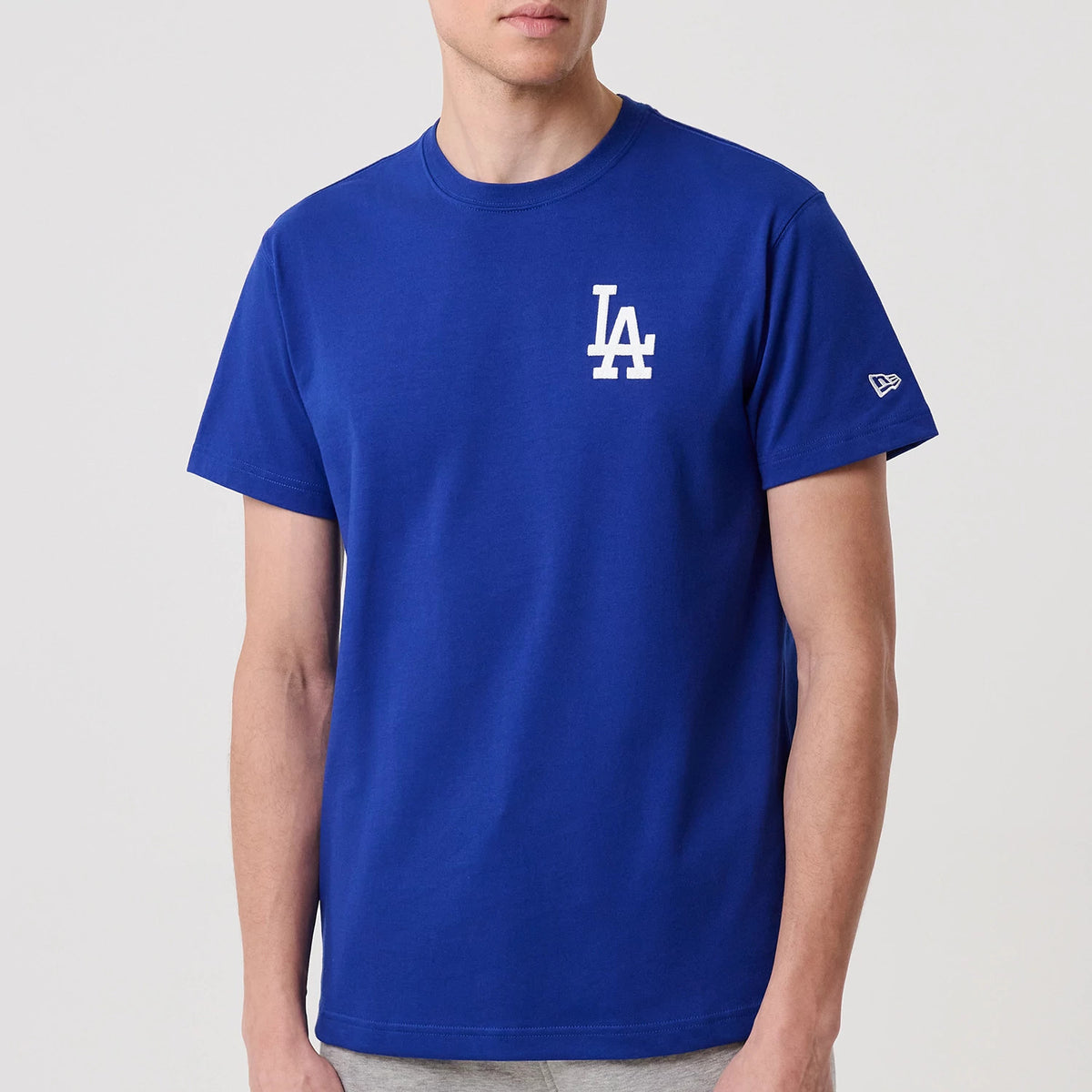 LA Dodgers MLB Banana Graphic Bright Blue T-Shirt, front view showing a blue shirt with a white embroidered LA logo on the left chest and a small embroidered New Era logo on the left sleeve.