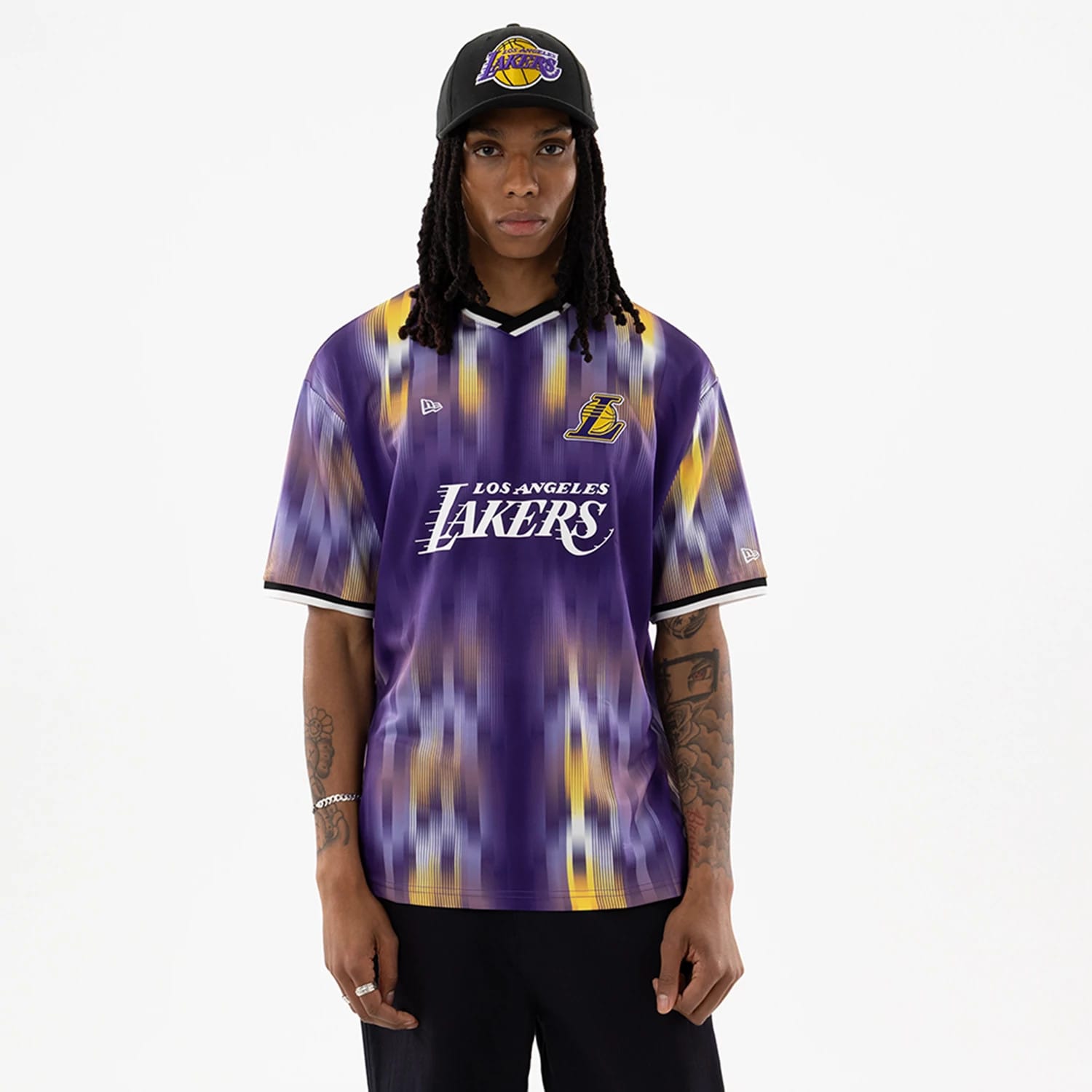 The model is wearing this NBA LA Lakers Soccer Jersey in purple. 1