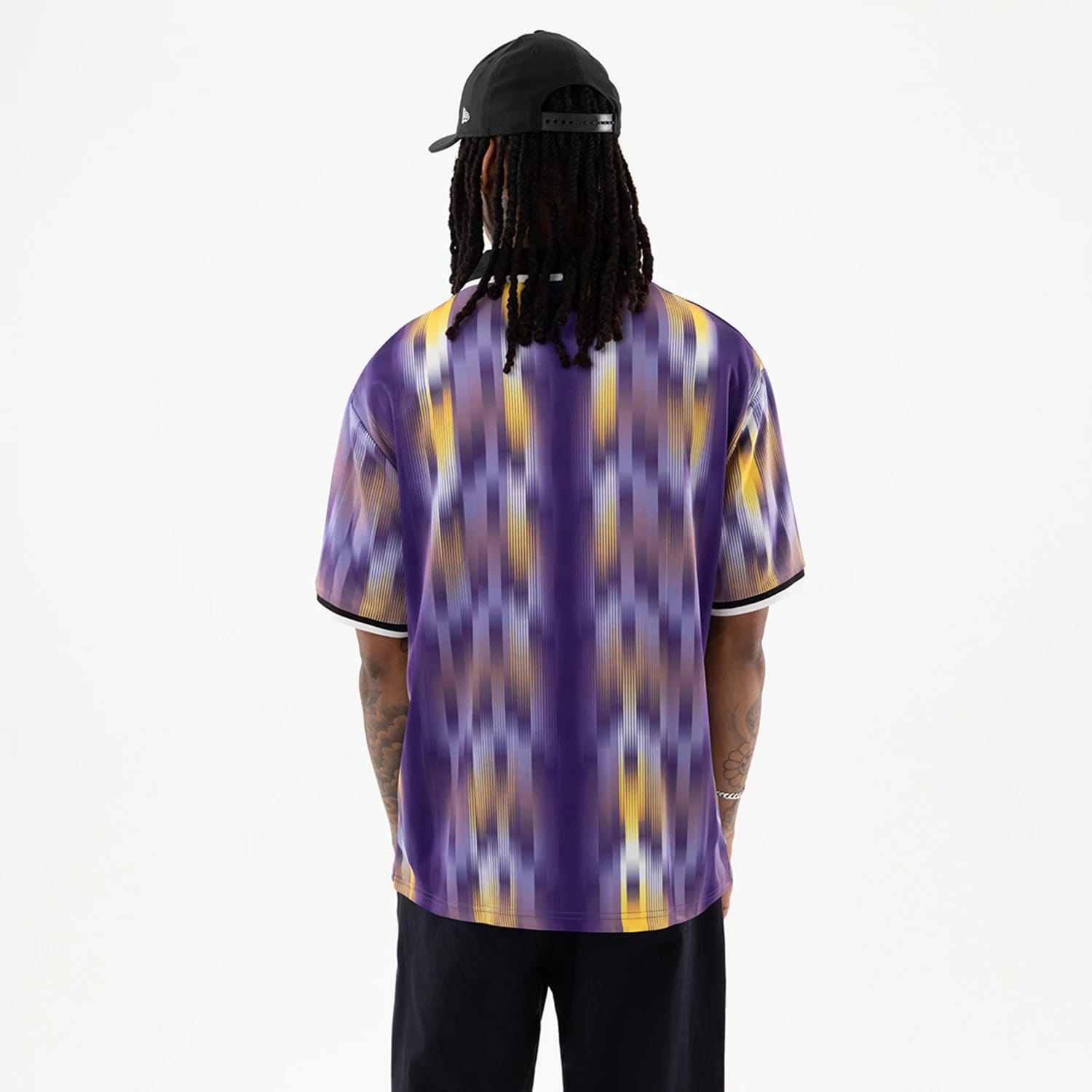 The model is wearing this NBA LA Lakers Soccer Jersey in purple. 2