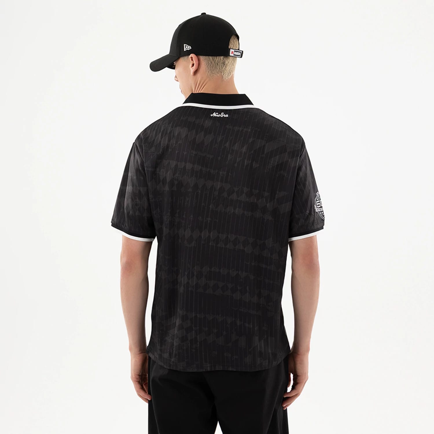 The model is wearing this NFL Las Vegas Raiders Soccer Jersey in black. 2