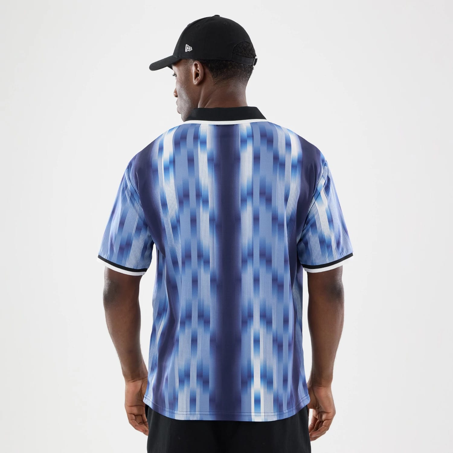 The model is wearing this New Era Soccer Jersey in navy. 2
