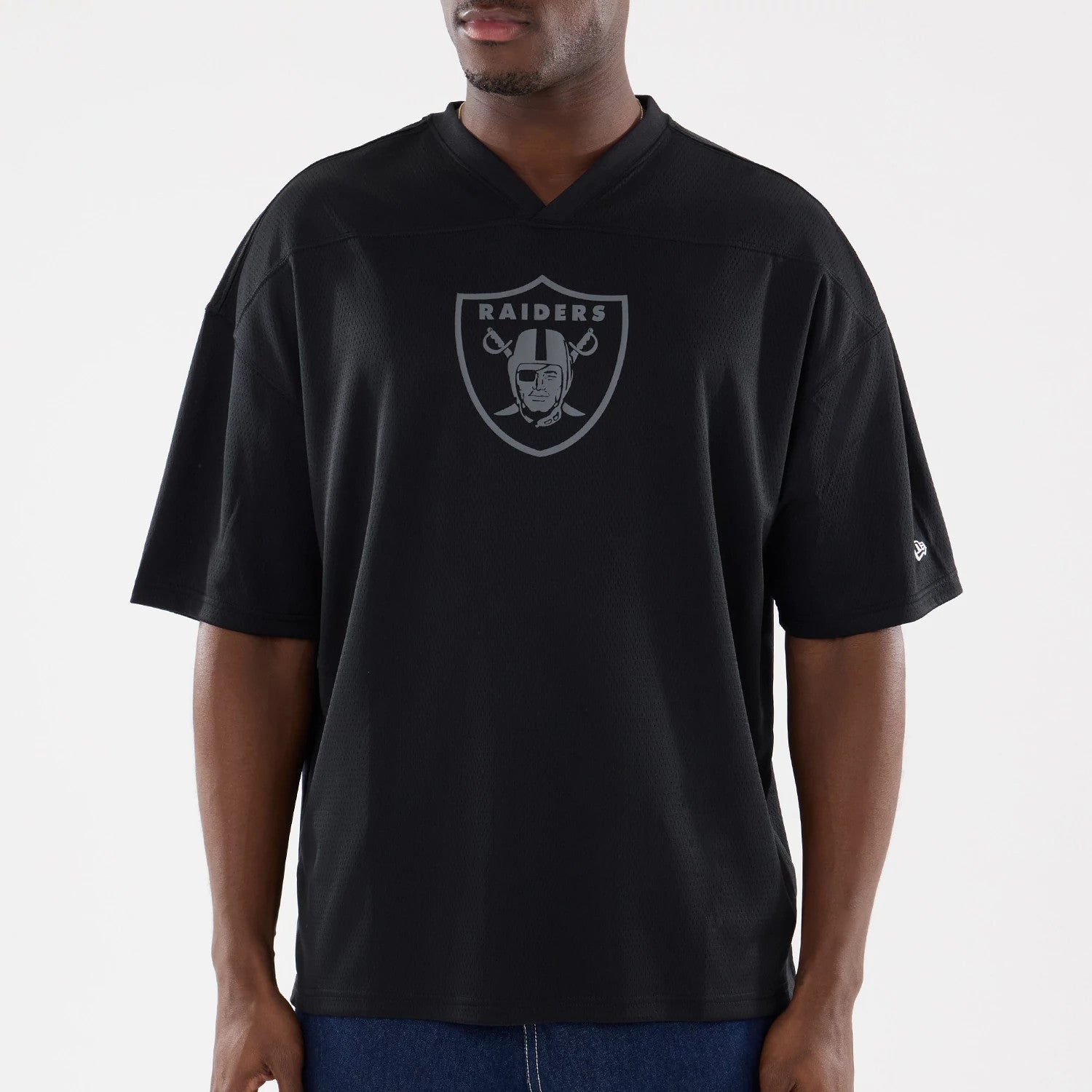 The model is wearing this NFL Raiders Wear Black Las Vegas Raiders Mesh Oversized T-Shirt in black. 3
