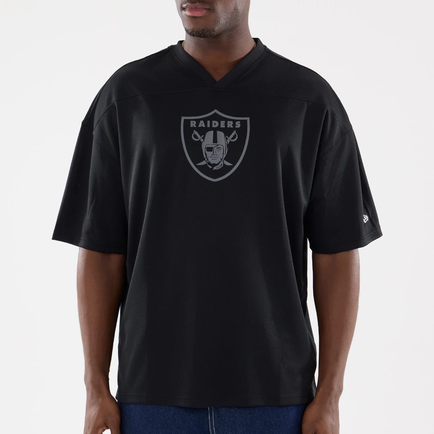 The model is wearing this NFL Raiders Wear Black Las Vegas Raiders Mesh Oversized T-Shirt in black. 3