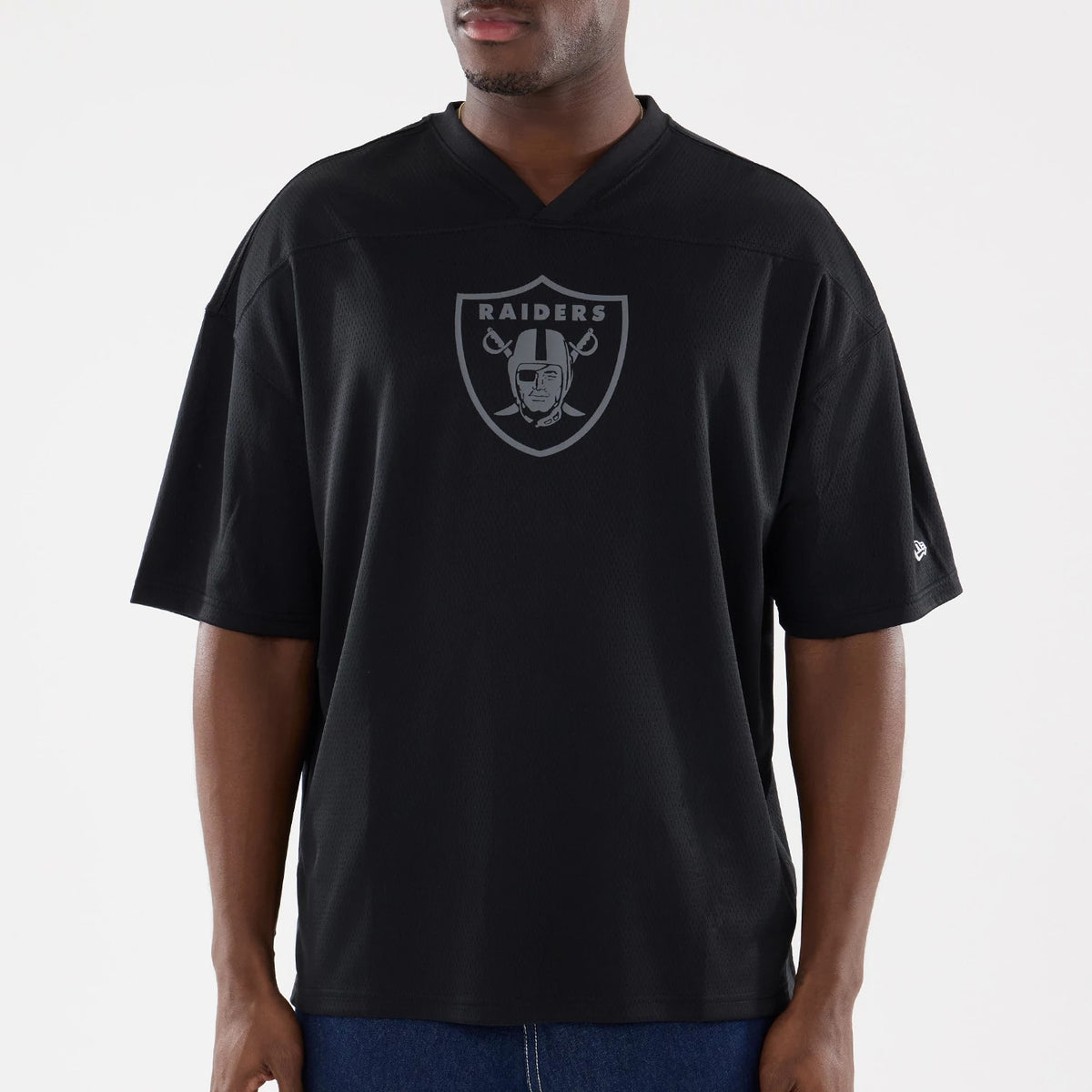 The model is wearing this NFL Raiders Wear Black Las Vegas Raiders Mesh Oversized T-Shirt in black. 3