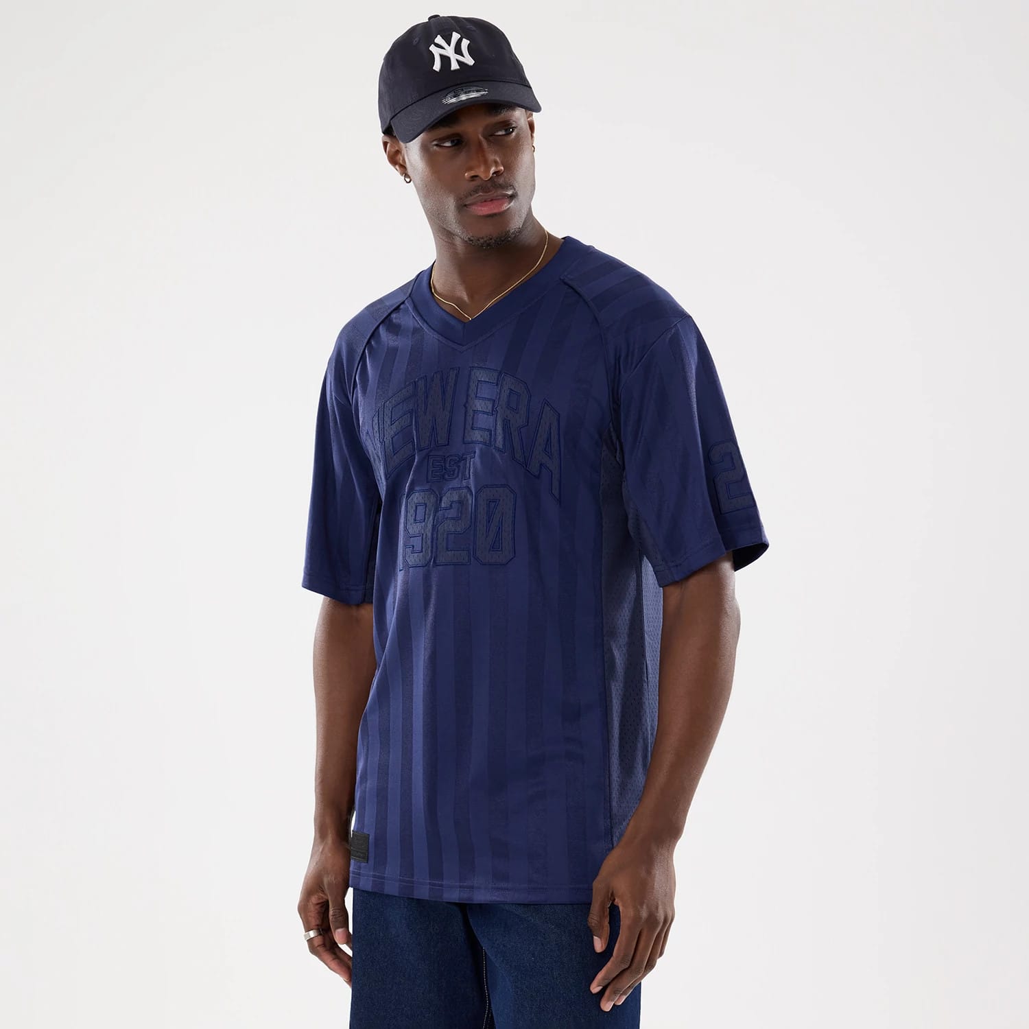 The model is wearing this New Era Street Archived Mesh Jersey in navy. 1