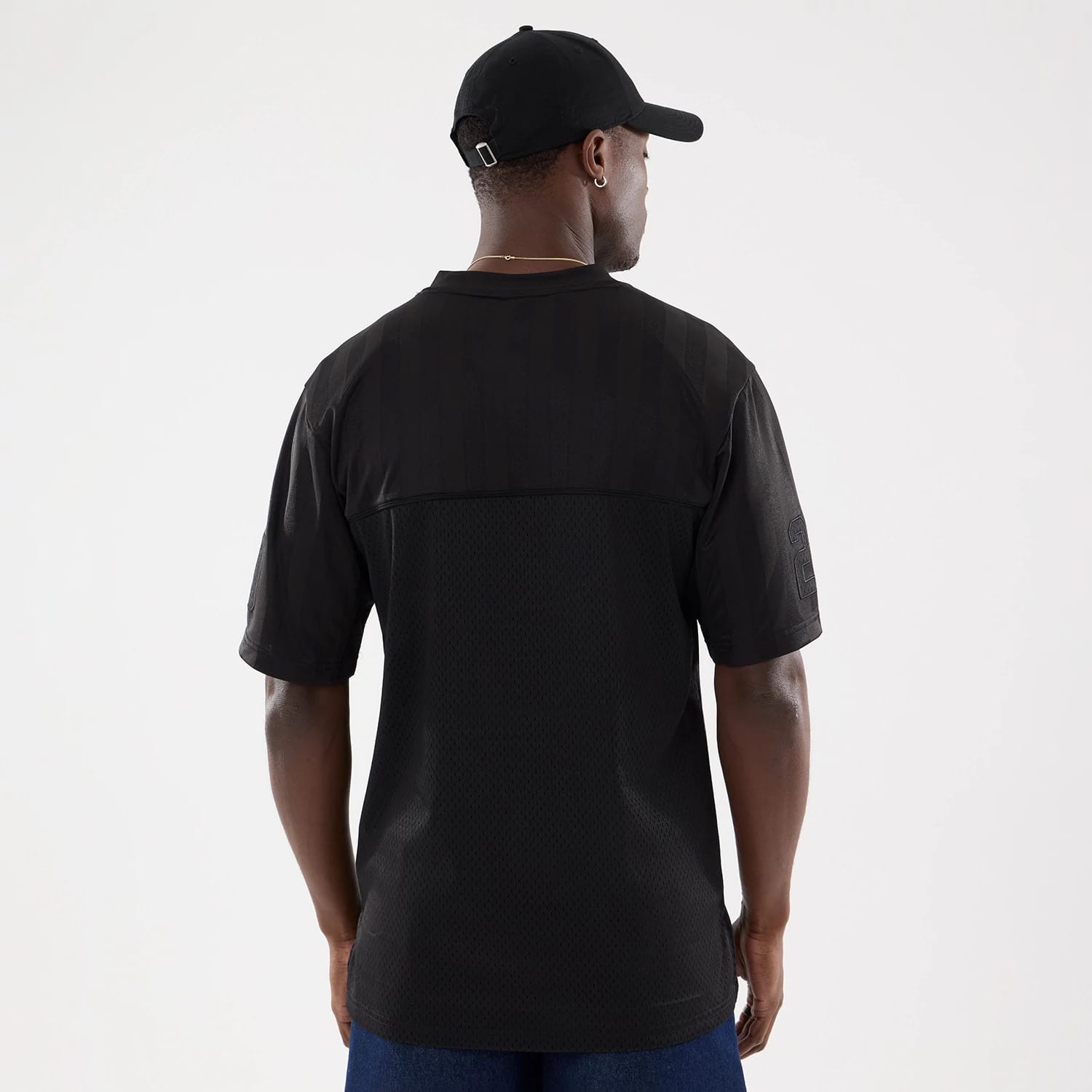 The model is wearing this New Era Street Archived Mesh Jersey in black. 2