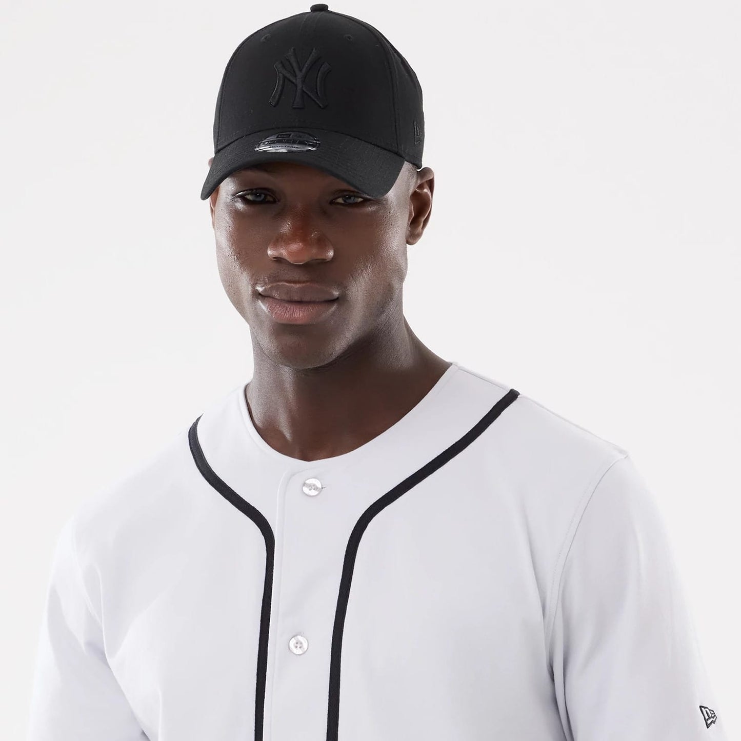 The model is wearing this New Era Basic Jersey in white. 7