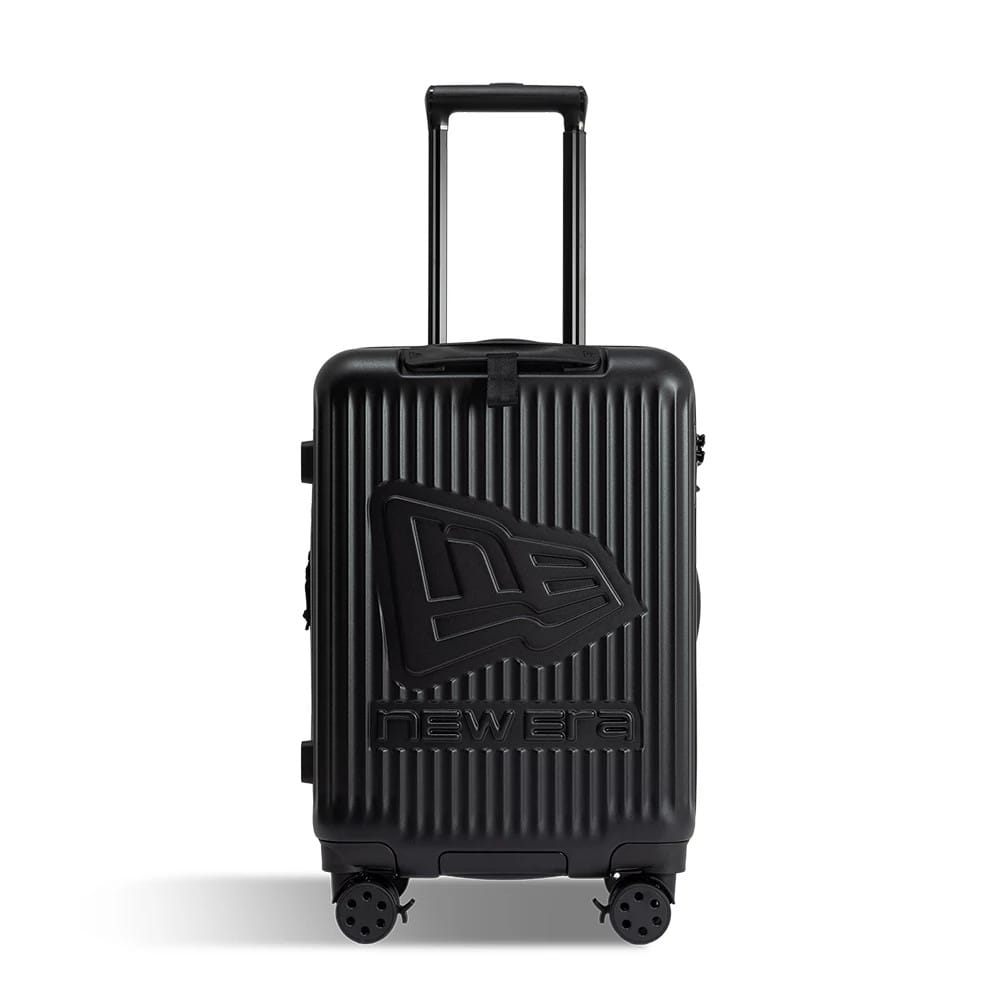 New Era Black Wheeled Cabin Case, front view showing a ribbed black exterior with a raised New Era logo centred on the front, an extendable handle at the top, and double wheels at the base for mobility.