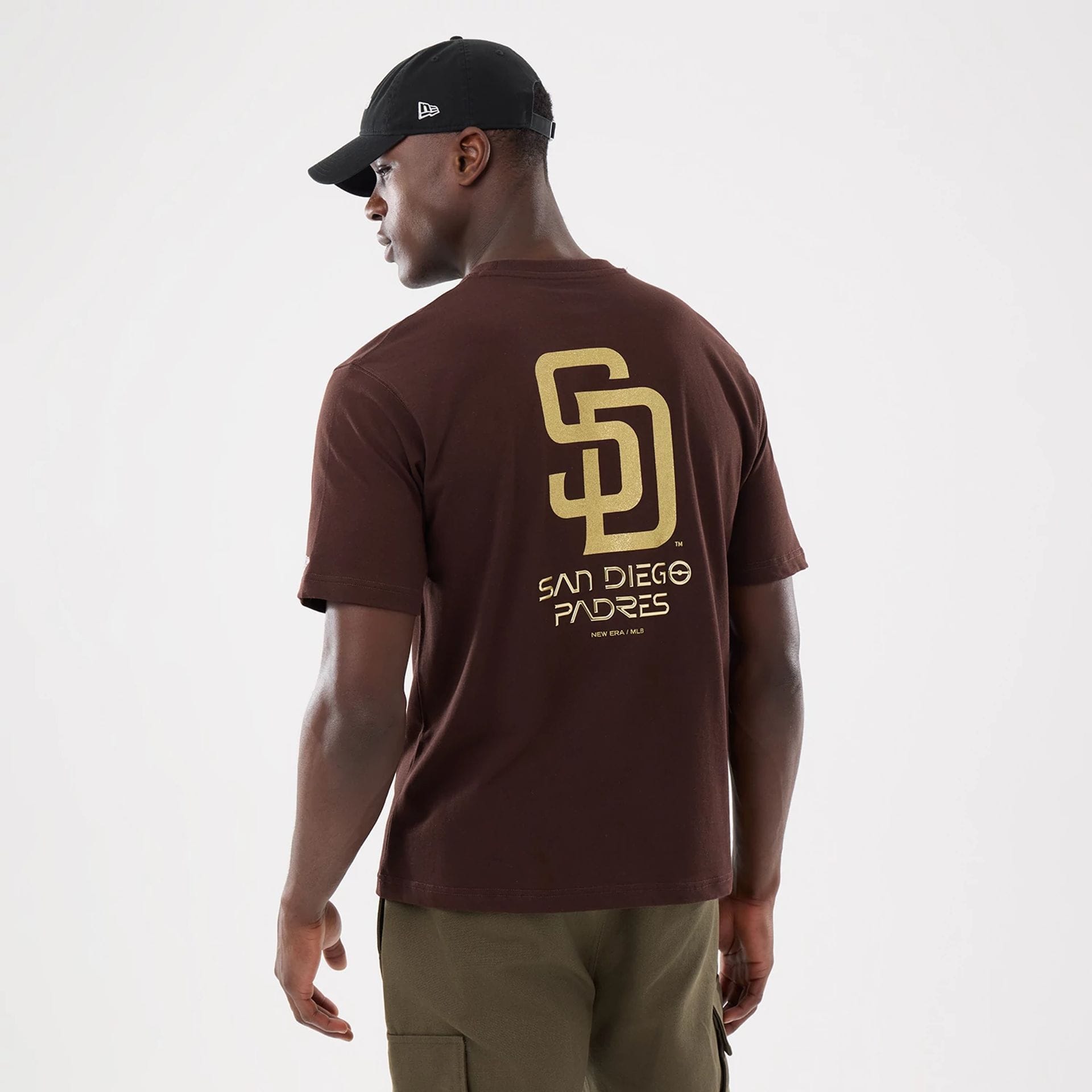 The model is wearing this Hajime Sorayama X MLB San Diego Padres T-Shirt in Dark Brown. 2