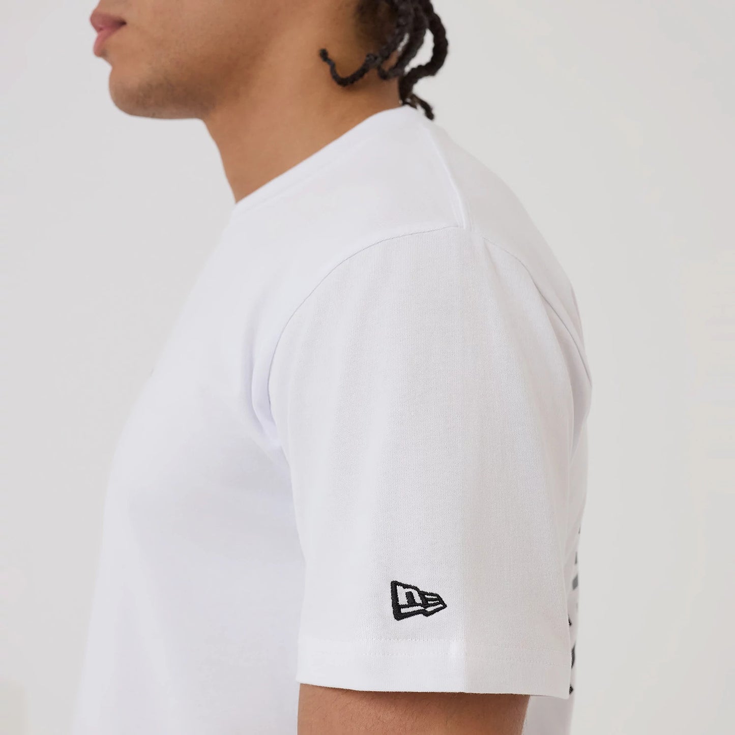 The model is wearing this New Era Circle T-Shirt in white. 7