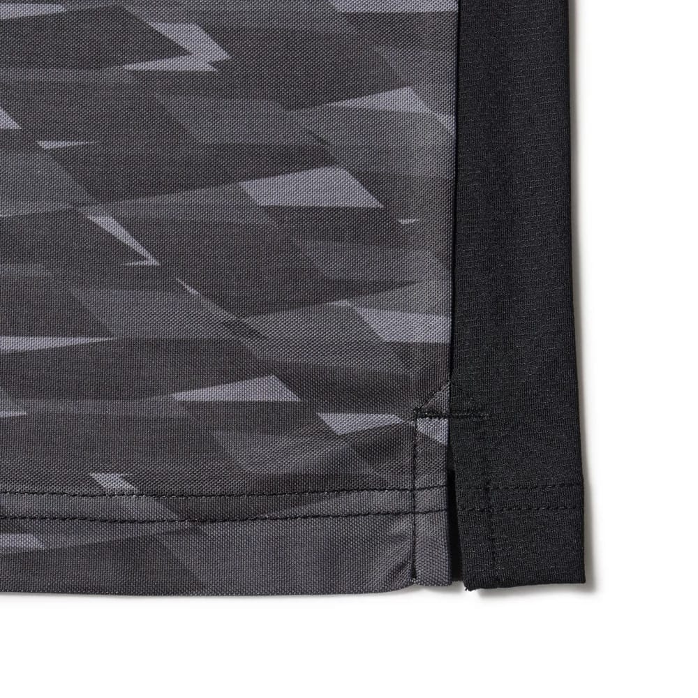 The model is wearing this New Era Grid Polo T-Shirt in black. 8