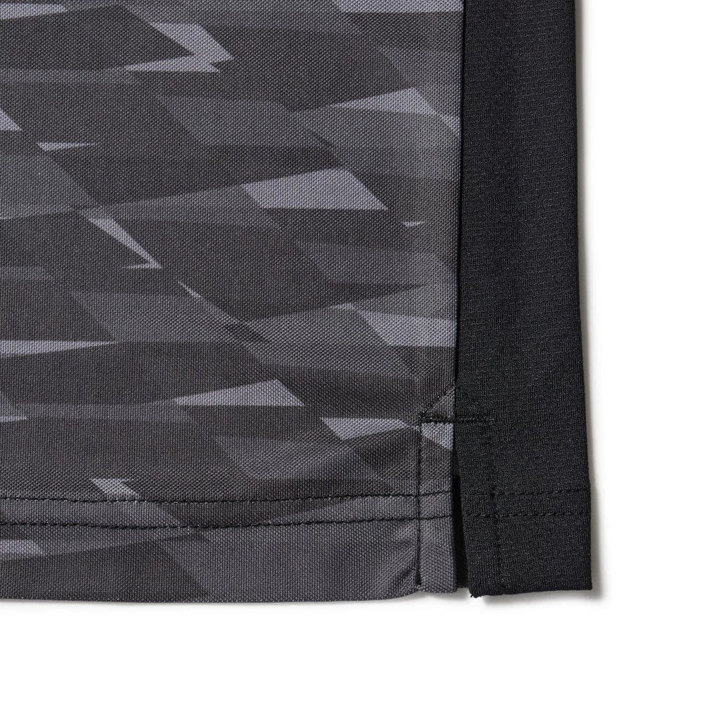 The model is wearing this New Era Grid Polo T-Shirt in black. 8