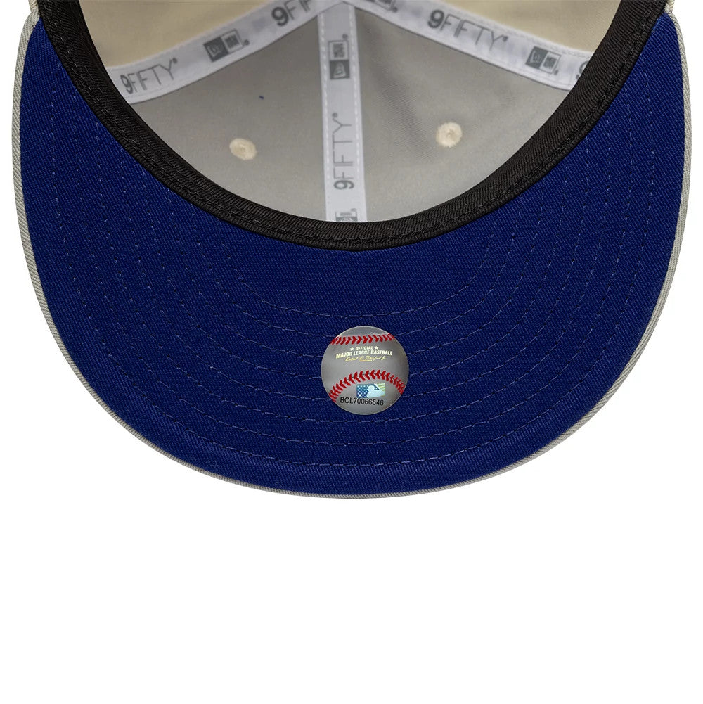 LA Dodgers Hajime Sorayama X MLB Cream Retro Crown New Era 9FIFTY Adjustable Cap, inside view showing grey 9FIFTY taping, black sweatband, and an MLB holographic sticker on the blue undervisor.