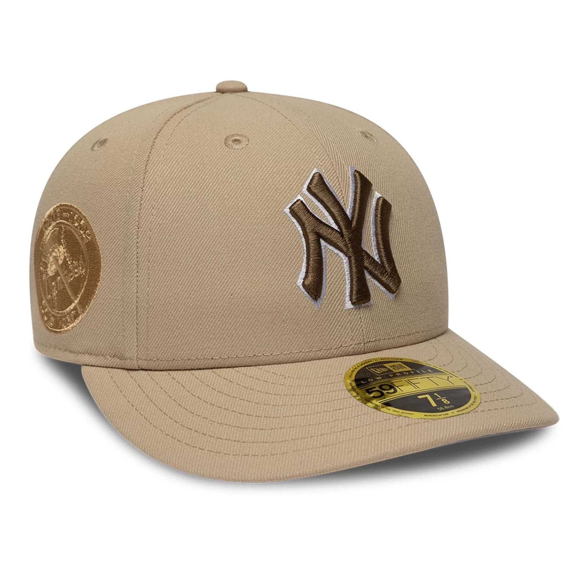 Pictured is this MLB College Varsity New York Yankees Low Profile 59FIFTY Fitted cap in beige. 1