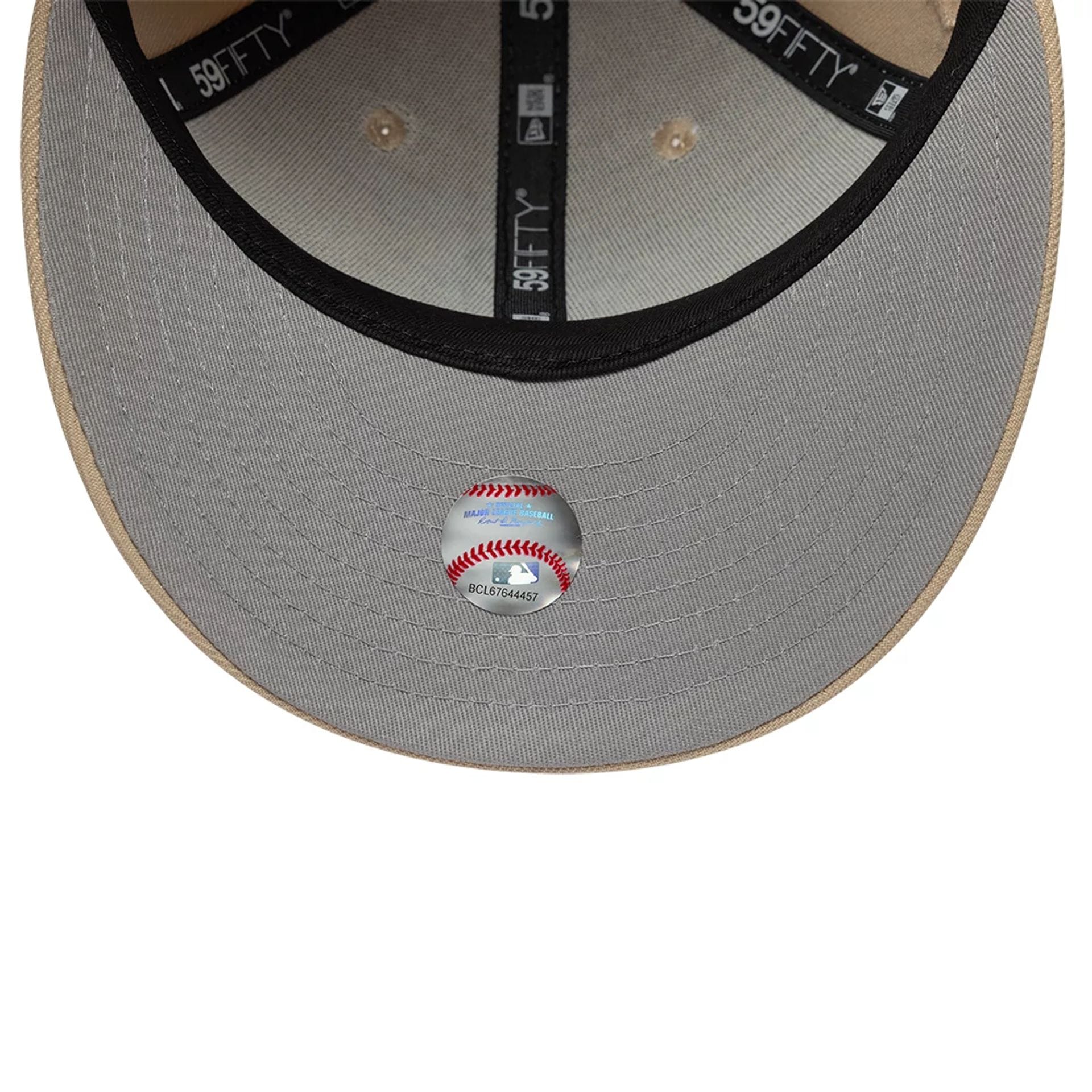 Pictured is this MLB College Varsity New York Yankees Low Profile 59FIFTY Fitted cap in beige. 2