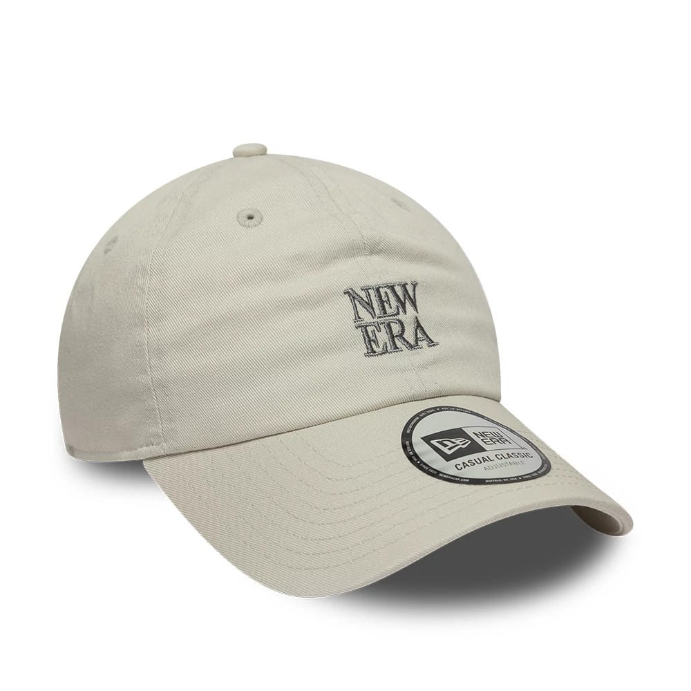 New Era Square Logo Cream Casual Classic Adjustable Cap, front view showing grey embroidered New Era logo on the front panel, adjustable strap at the back, and Casual Classic size sticker on the curved visor.