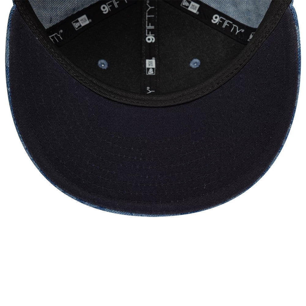 Pictured is this New Era Laser Burnout Washed Denim 9FIFTY Snapback Adjustable cap in navy. 2