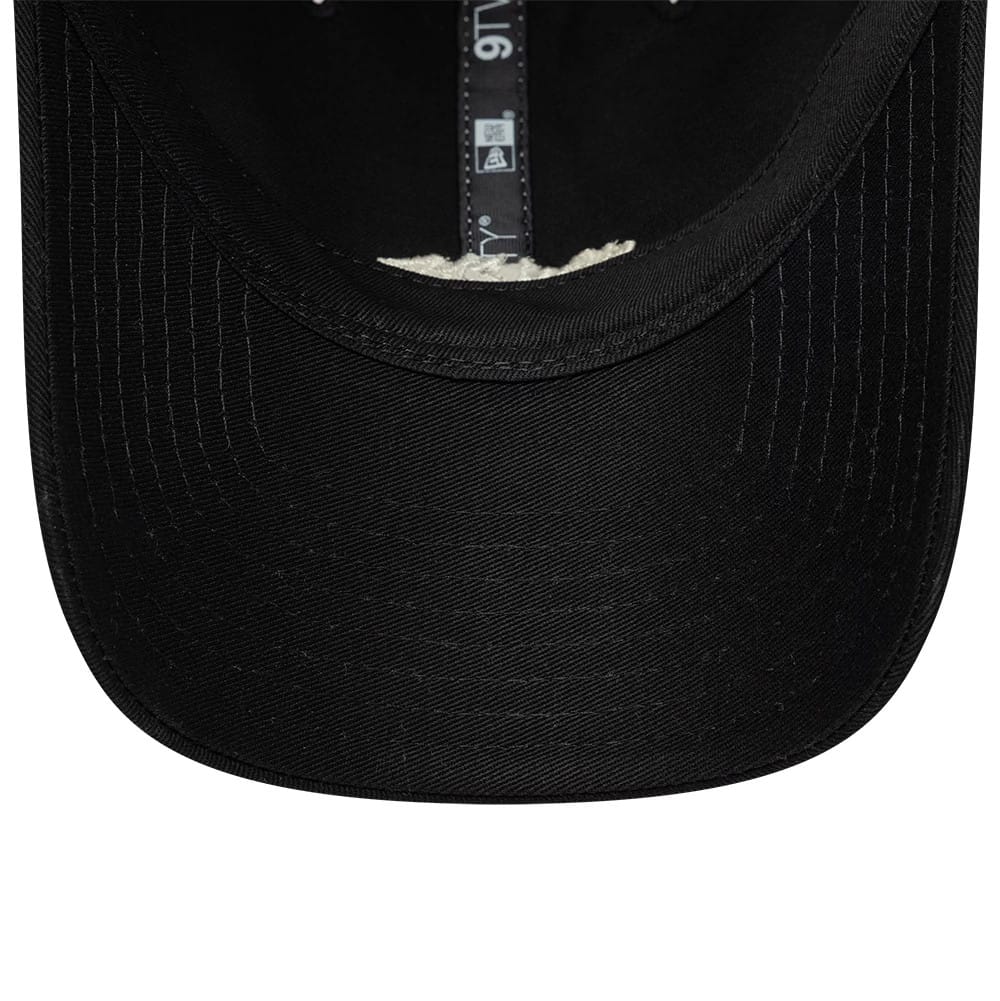 Pictured is this New Era Tagging Logo 9TWENTY Trucker cap in black. 7