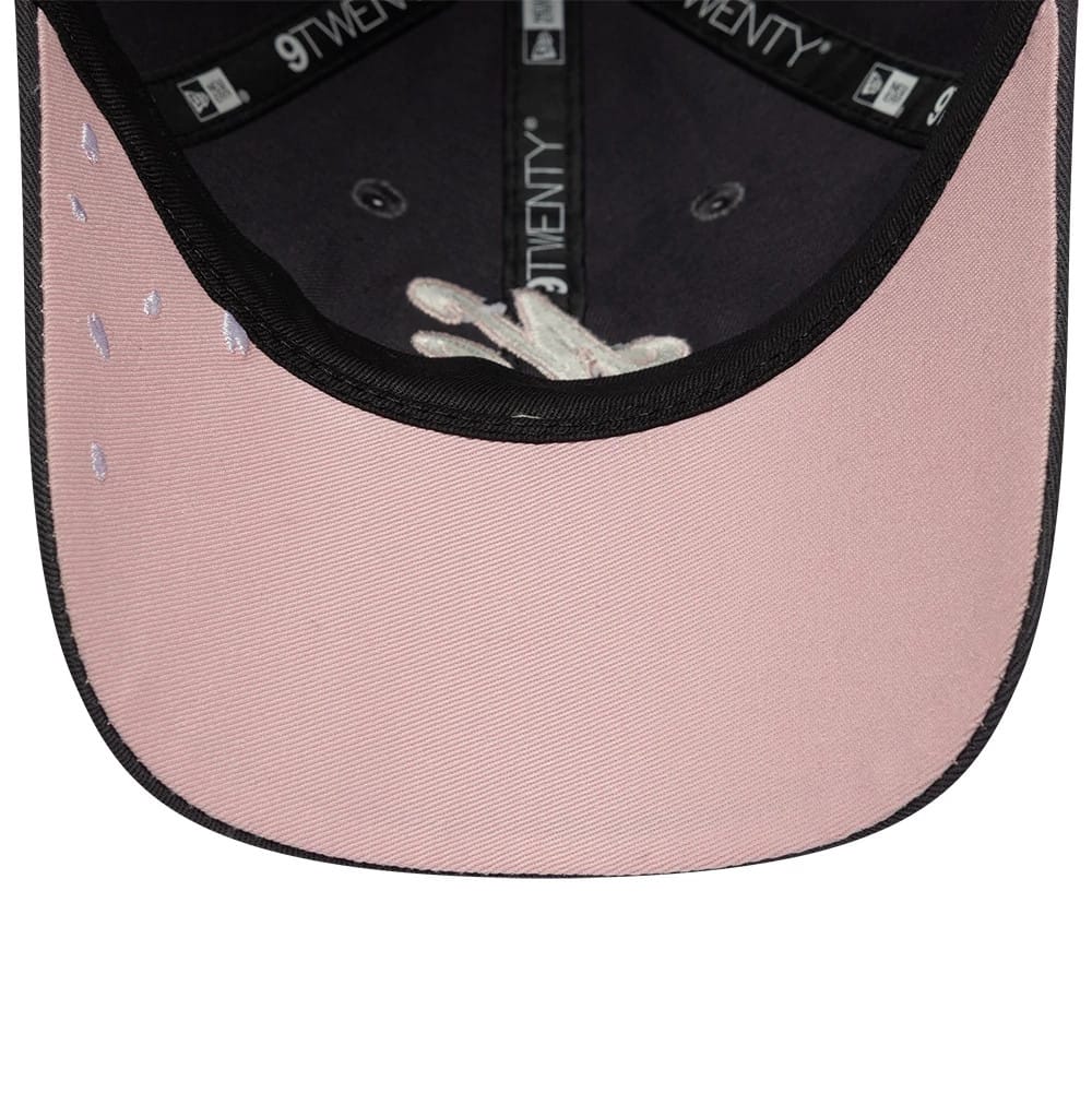 New Era Sakura Nagashi Dark Grey New Era 9TWENTY Adjustable Cap, inside view showing pink undervisor with delicate embroidered raindrop accents, black sweatband, and 9TWENTY taping along the interior crown.