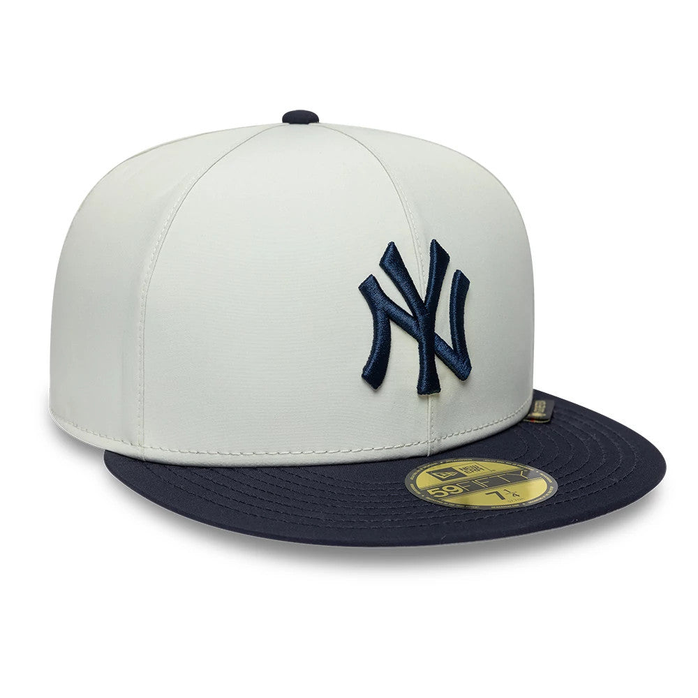 New York Yankees MLB X Gore-Tex White New Era 59FIFTY Fitted Cap, three-quarter view showing a raised navy NY logo on the front panel, contrasting navy visor with a gold 59FIFTY size sticker, and top button in navy.