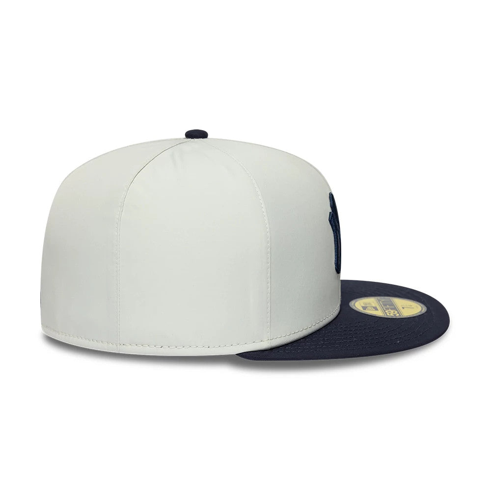 New York Yankees MLB X Gore-Tex White New Era 59FIFTY Fitted Cap, side view showing the navy raised embroidered NY logo on the front panel, navy visor with gold 59FIFTY size sticker, and navy top button.
