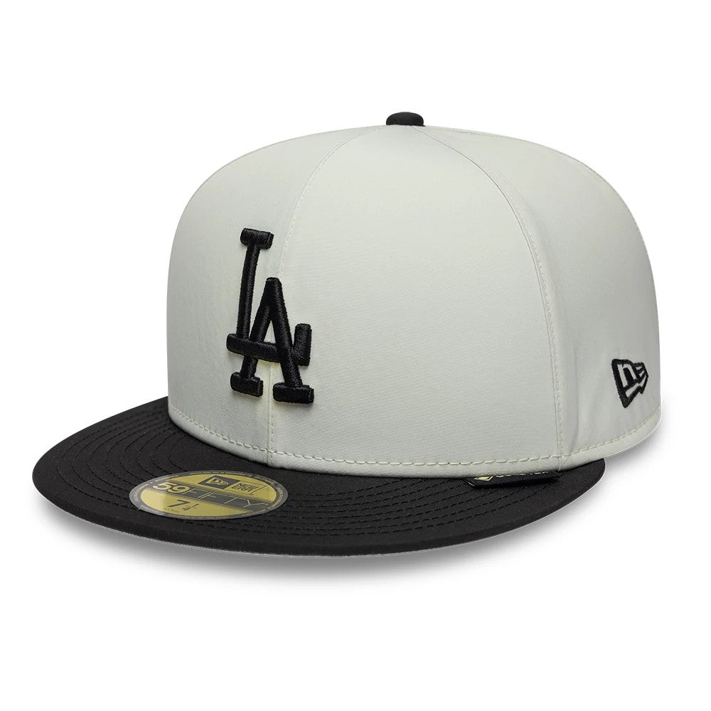 LA Dodgers MLB X Gore-Tex Black New Era 59FIFTY Fitted Cap, three-quarter view showing the raised black LA logo on the front panel, black visor with gold 59FIFTY size sticker, and New Era flag logo on the left side.