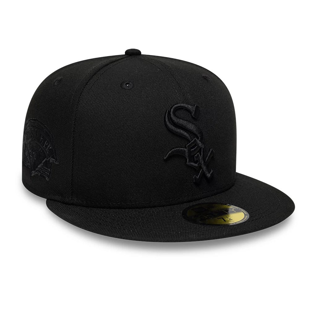 Chicago White Sox MLB Black On Black New Era 59FIFTY Fitted Cap, front view with raised embroidered team logo on the front panel, New Era flag logo on the left side, and the gold 59FIFTY size sticker on the flat visor.