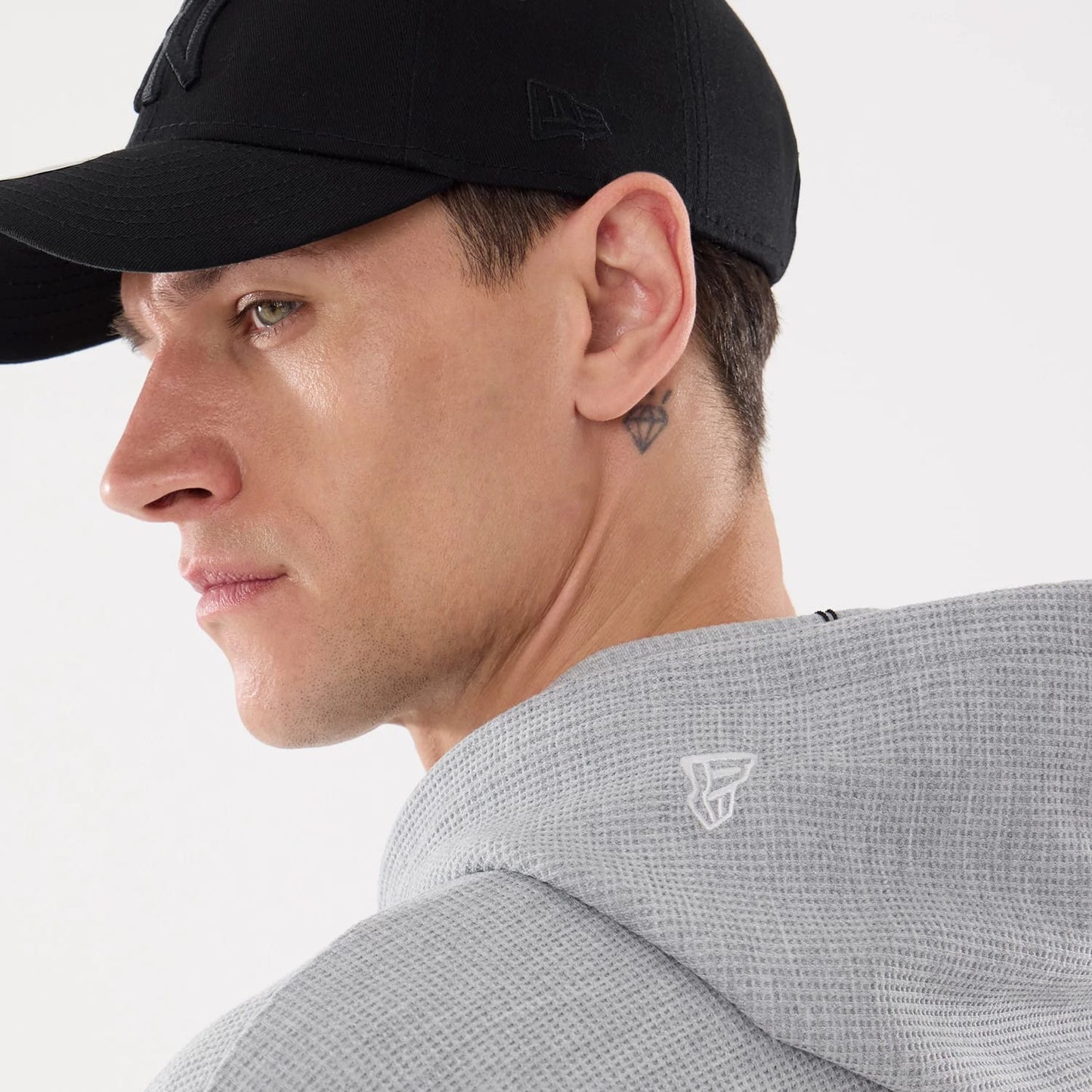 The model is wearing this New Era Waffle Full Zip Hoodie in grey. 7
