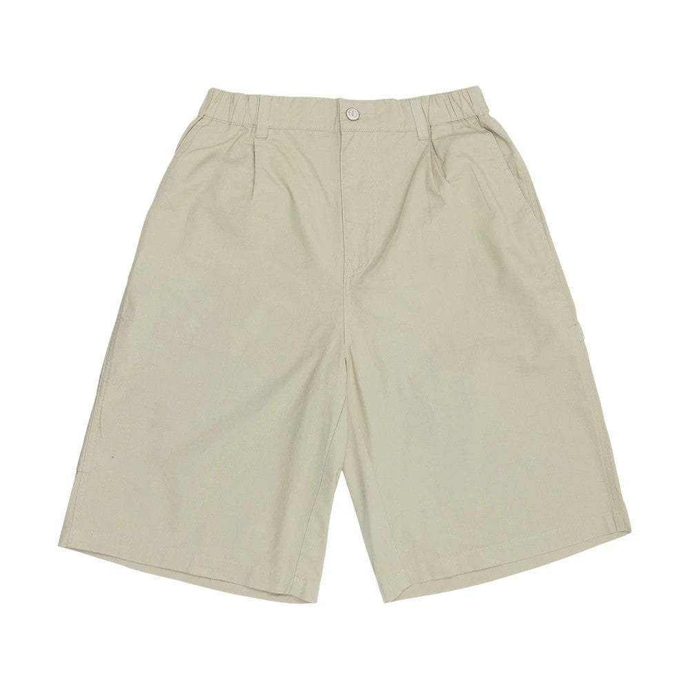 The model is wearing this New Era Canvas Bermuda Shorts in beige. 7