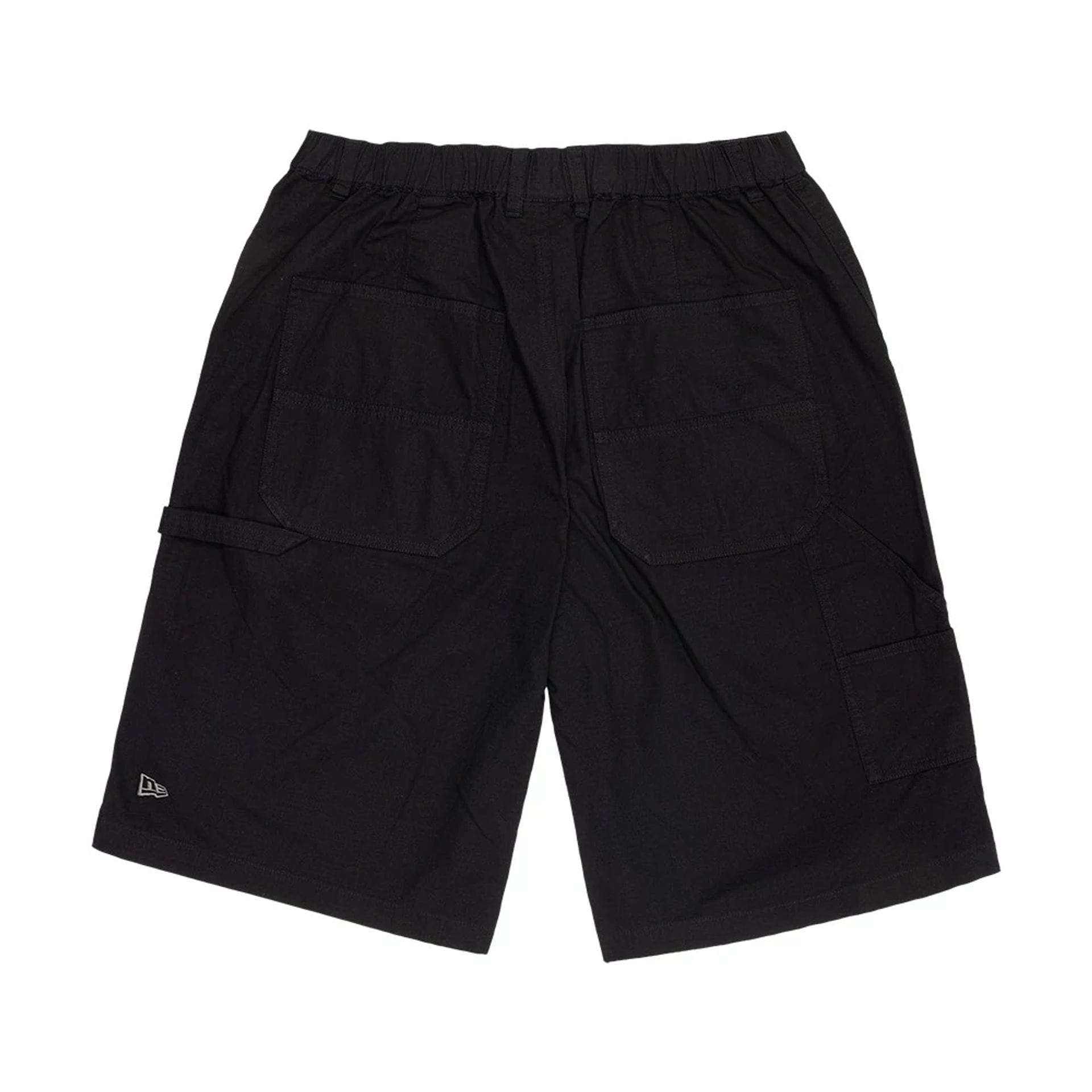 The model is wearing this New Era Canvas Bermuda Shorts in black. 2