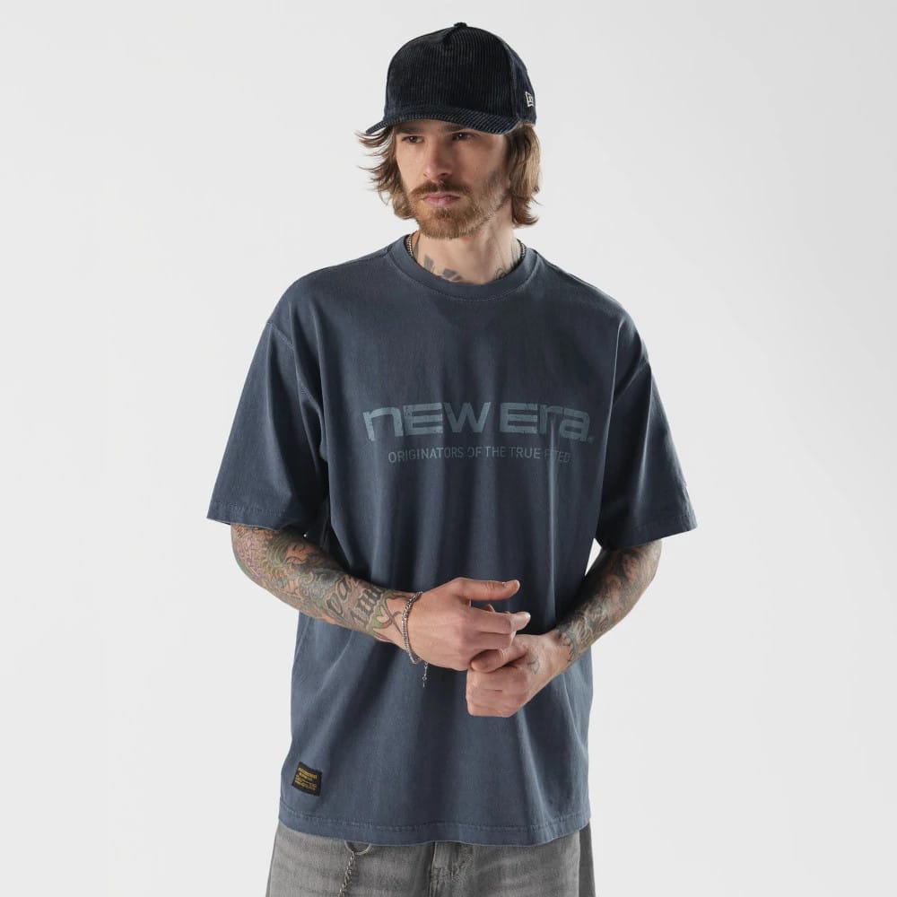 The model is wearing this New Era Originators T-Shirt in navy. 1