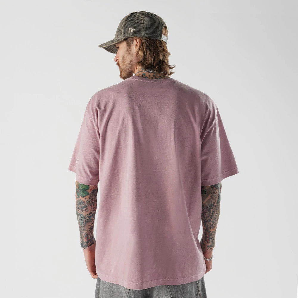 The model is wearing this New Era Originators T-Shirt in pink. 2