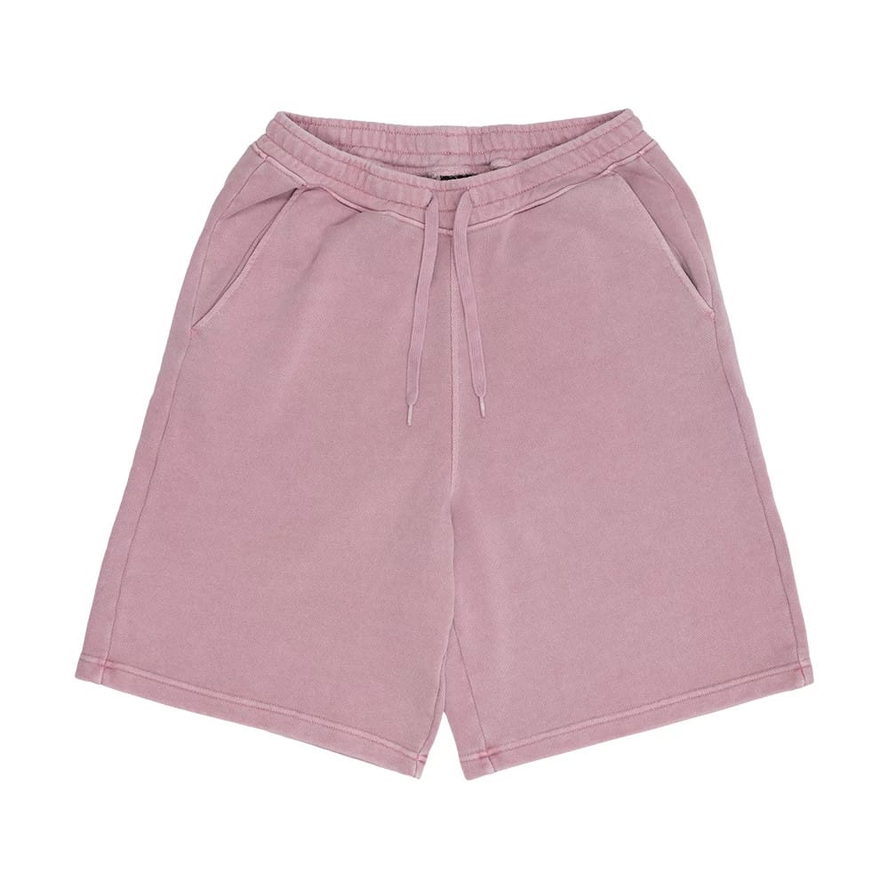 New Era Originators Pink Oversized Shorts, front view showing the light pink fabric with an elasticated waistband, adjustable drawstrings hanging down, and side pockets outlined along the seams.