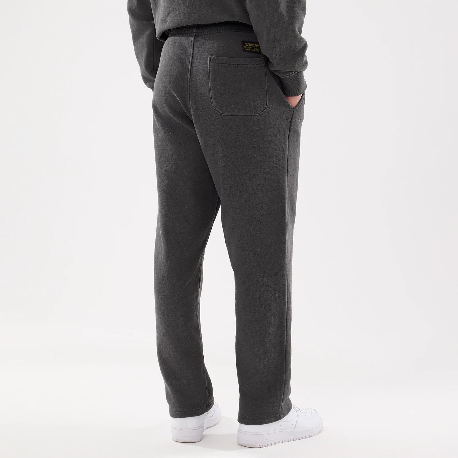 The model is wearing this New Era Originators Straight Leg Joggers in black. 2