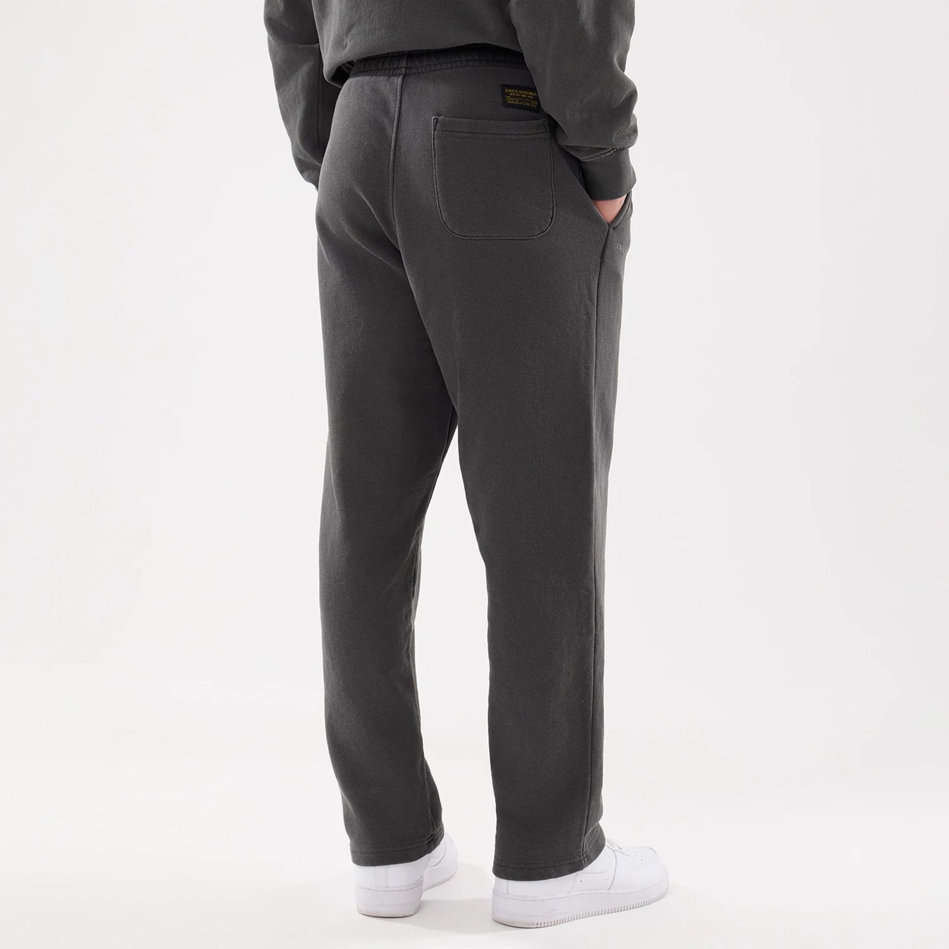 The model is wearing this New Era Originators Straight Leg Joggers in black. 2